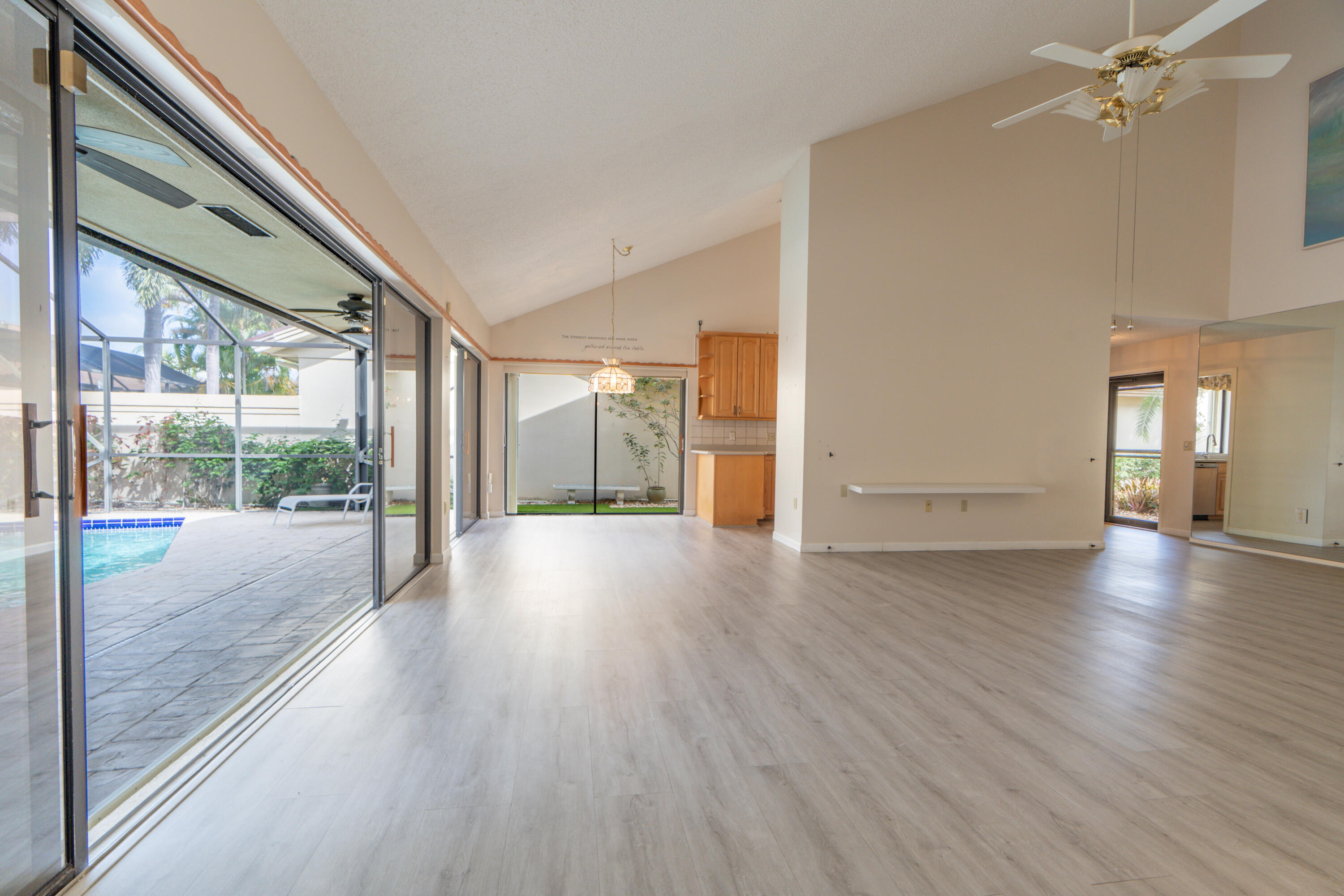 422 River Edge Road Jupiter, FL 33477 - Photo 21 of 39 a view of livingroom with floor to ceiling window with wooden floor