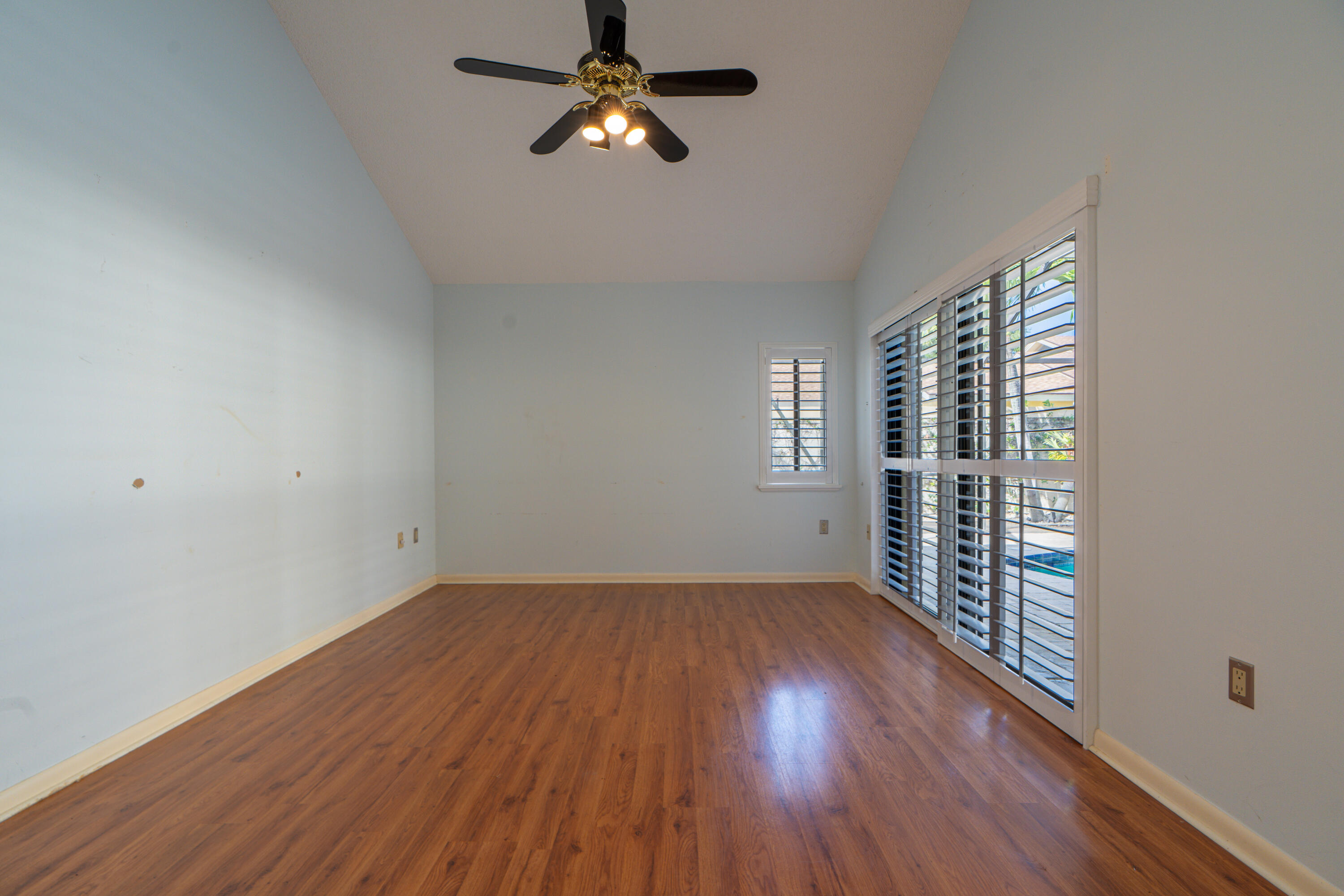 422 River Edge Road Jupiter, FL 33477 - Photo 31 of 39 wooden floor in an empty room with a window
