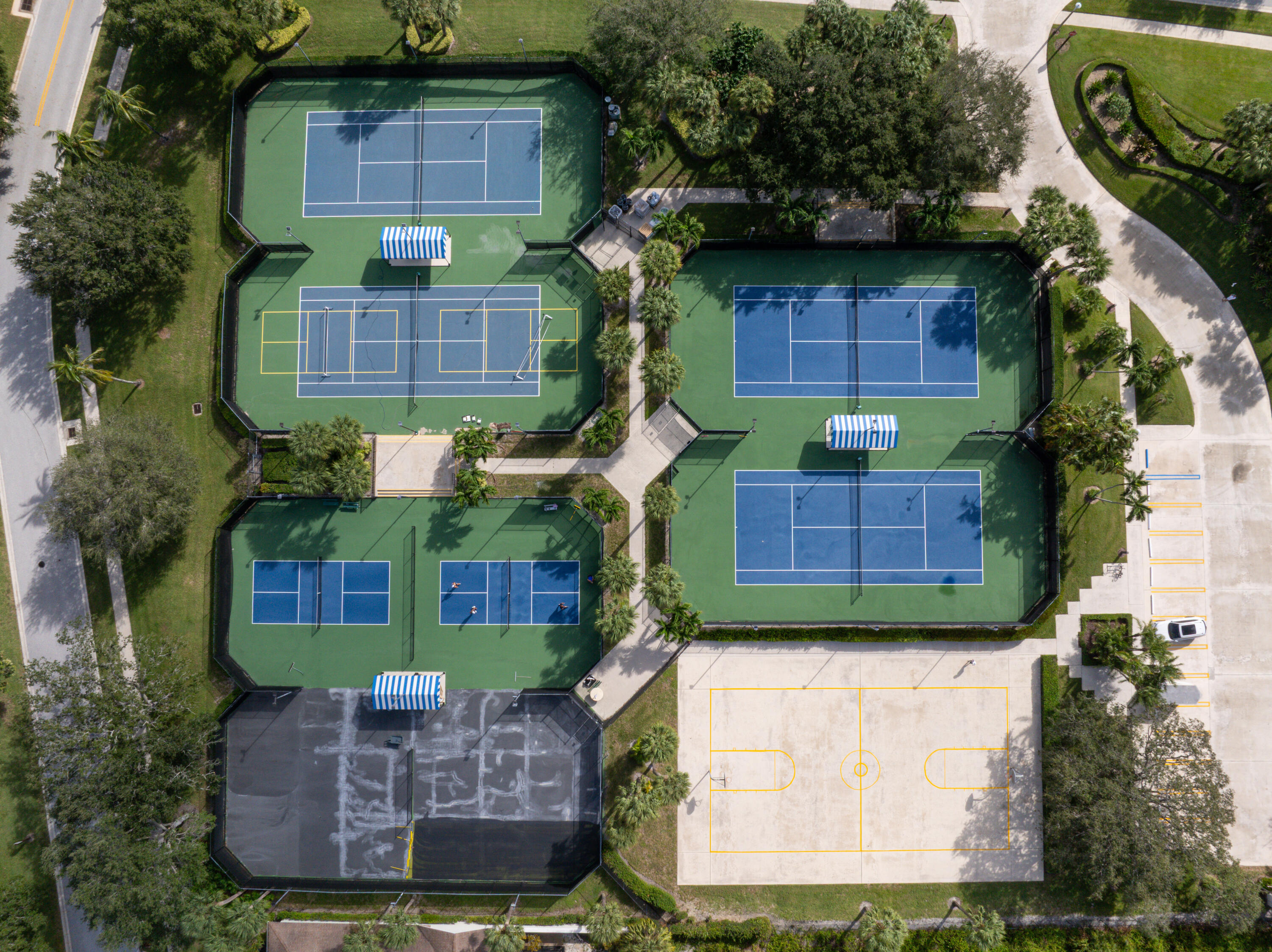 422 River Edge Road Jupiter, FL 33477 - Photo 9 of 39 a front view of a house with a garden
