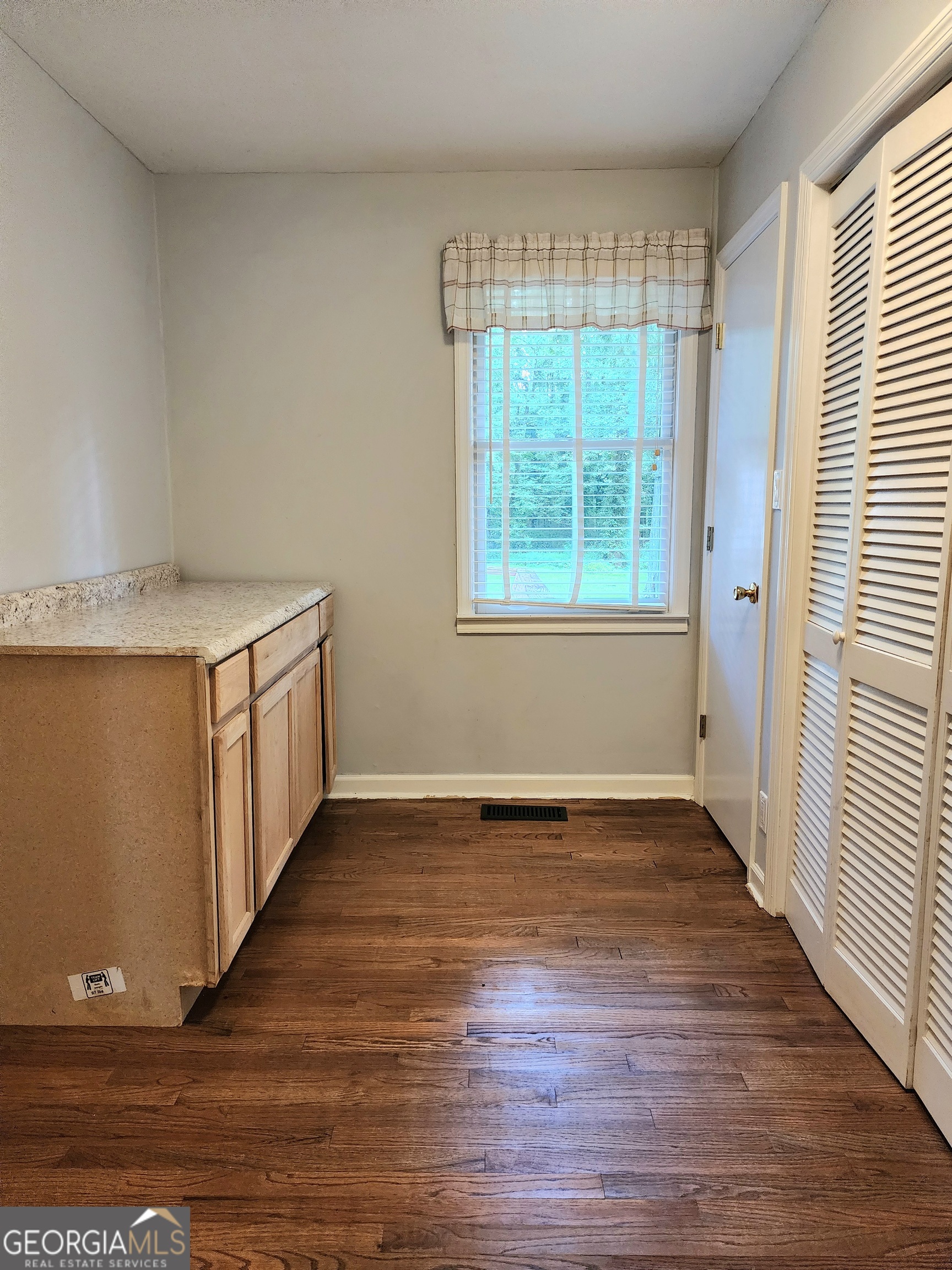 807 Wera Place Macon, GA 31210 - Photo 12 of 46 an empty room with wooden floor and windows