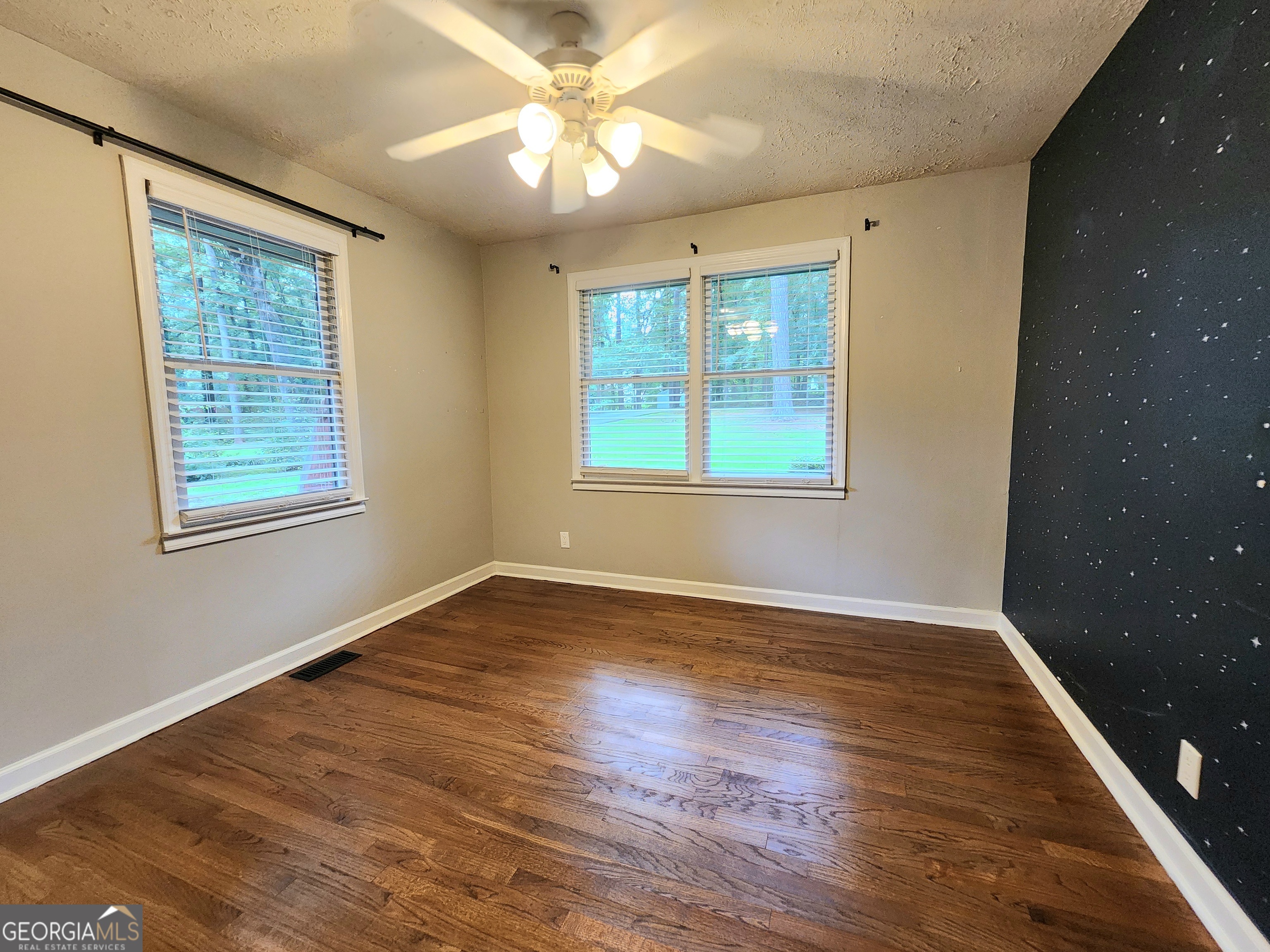 807 Wera Place Macon, GA 31210 - Photo 13 of 46 a view of an empty room with wooden floor and a window
