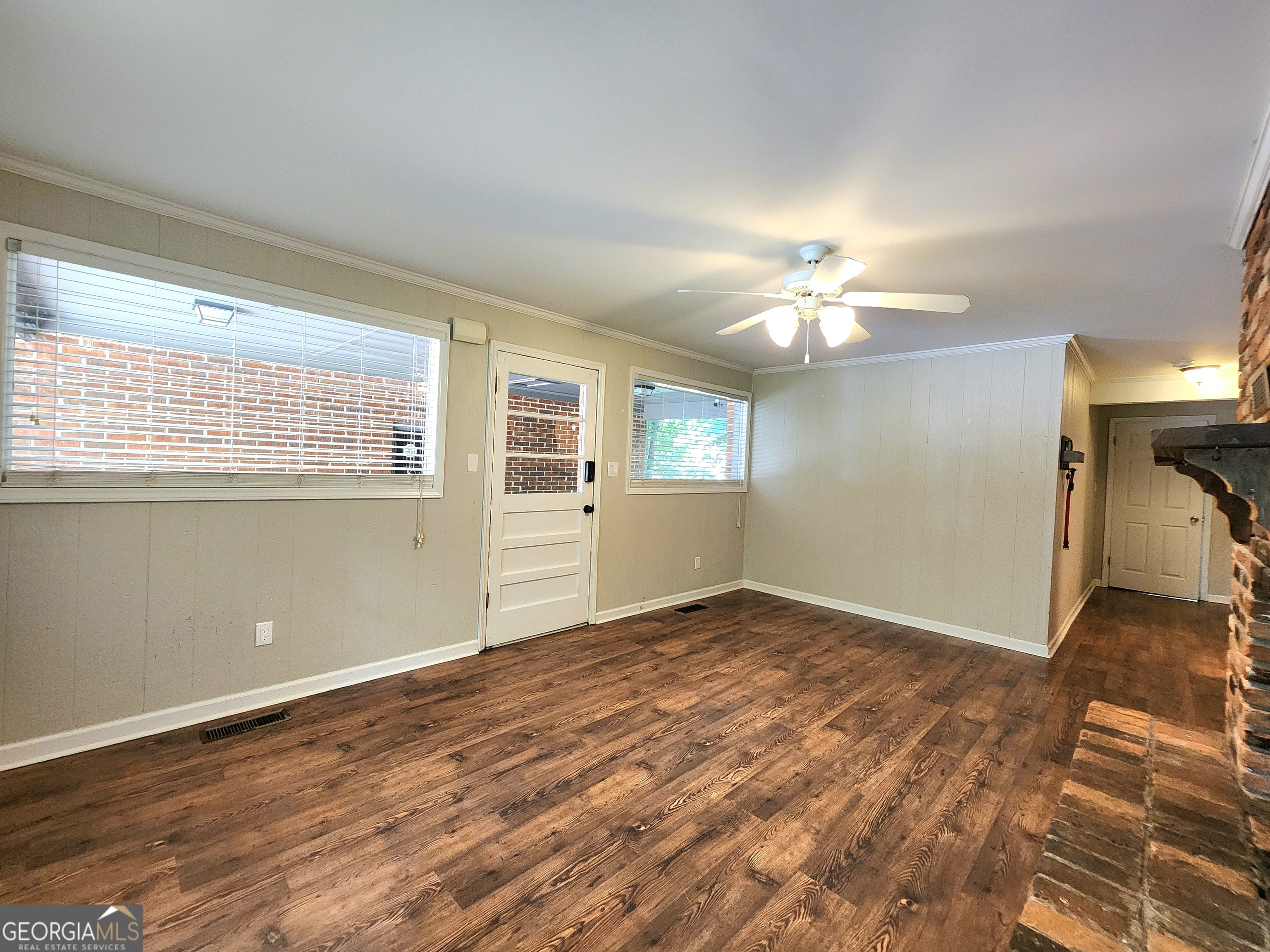 807 Wera Place Macon, GA 31210 - Photo 19 of 46 a view of an empty room with a window and wooden floor