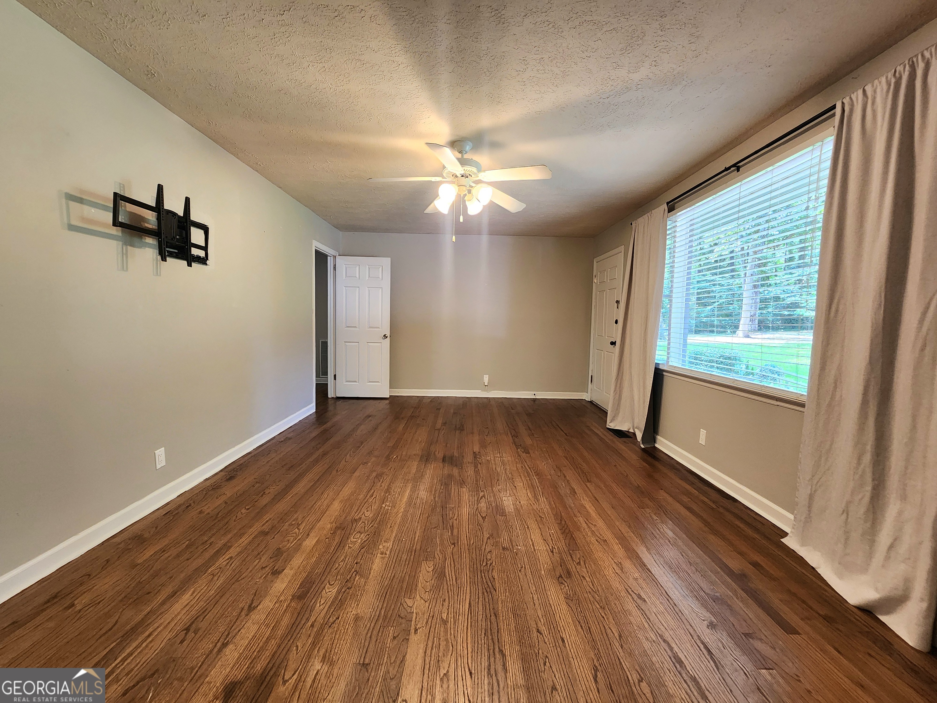 807 Wera Place Macon, GA 31210 - Photo 20 of 46 wooden floor in an empty room with a window