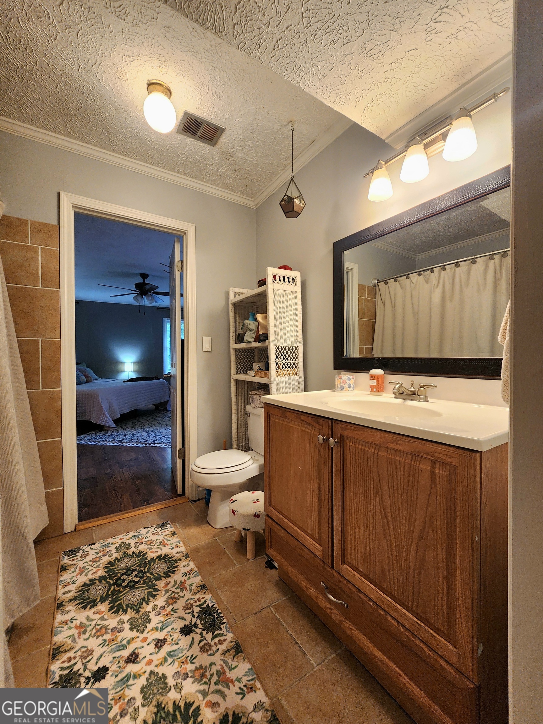 807 Wera Place Macon, GA 31210 - Photo 21 of 46 a living room with a couch and a flat screen tv