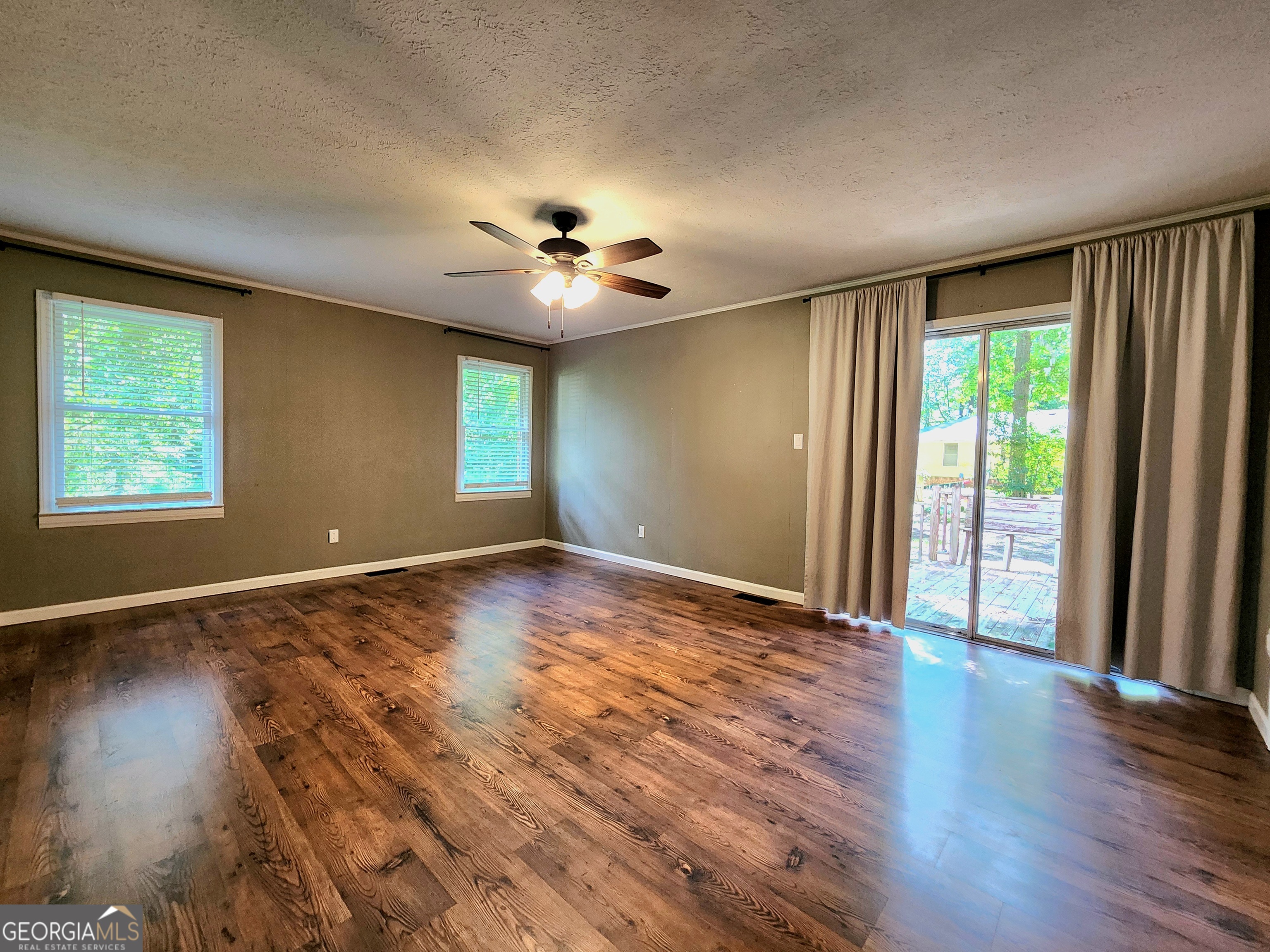 807 Wera Place Macon, GA 31210 - Photo 27 of 46 a view of an empty room with a window and wooden floor