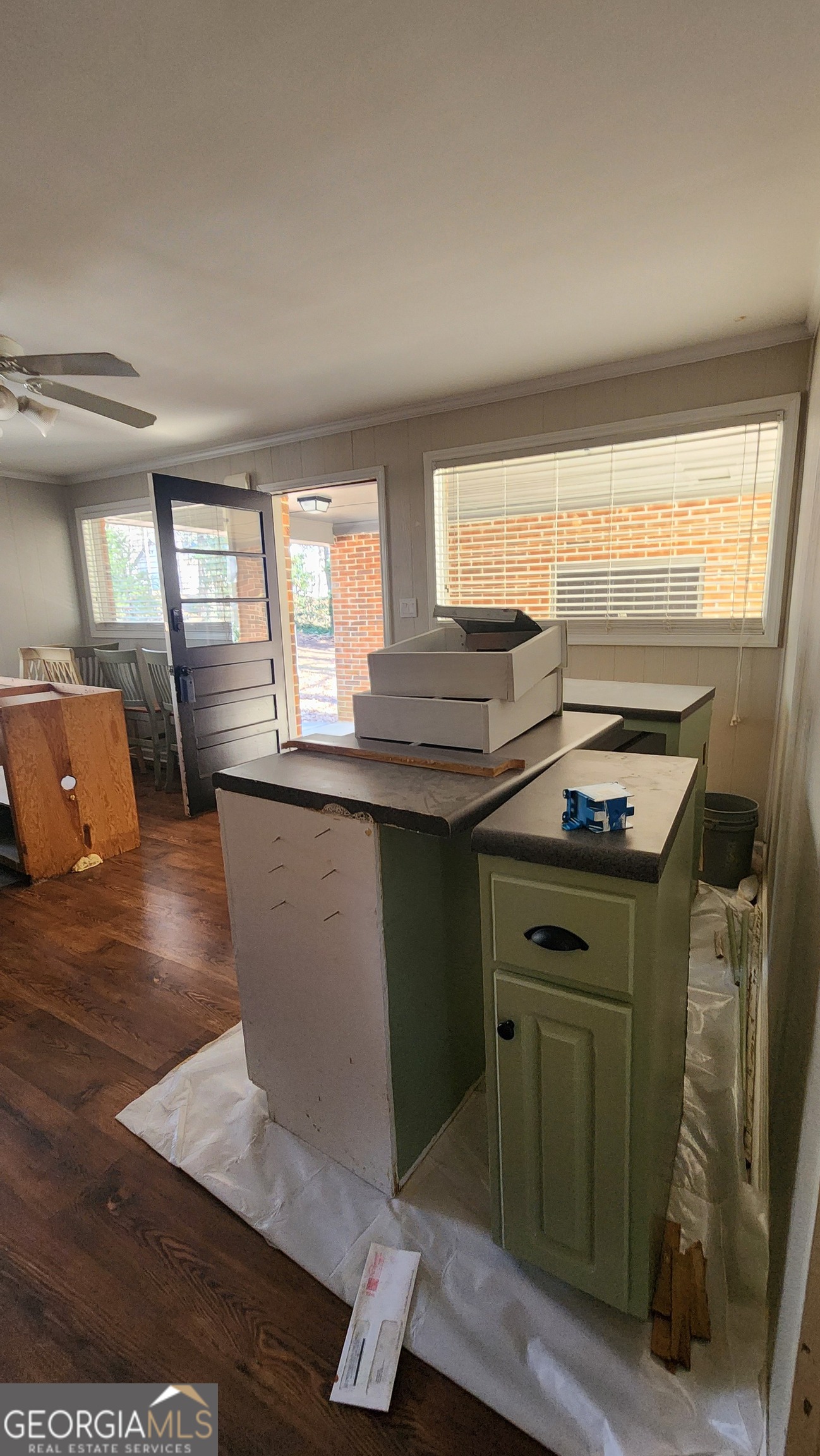 807 Wera Place Macon, GA 31210 - Photo 42 of 46 a kitchen with kitchen island a sink stove and wooden floor