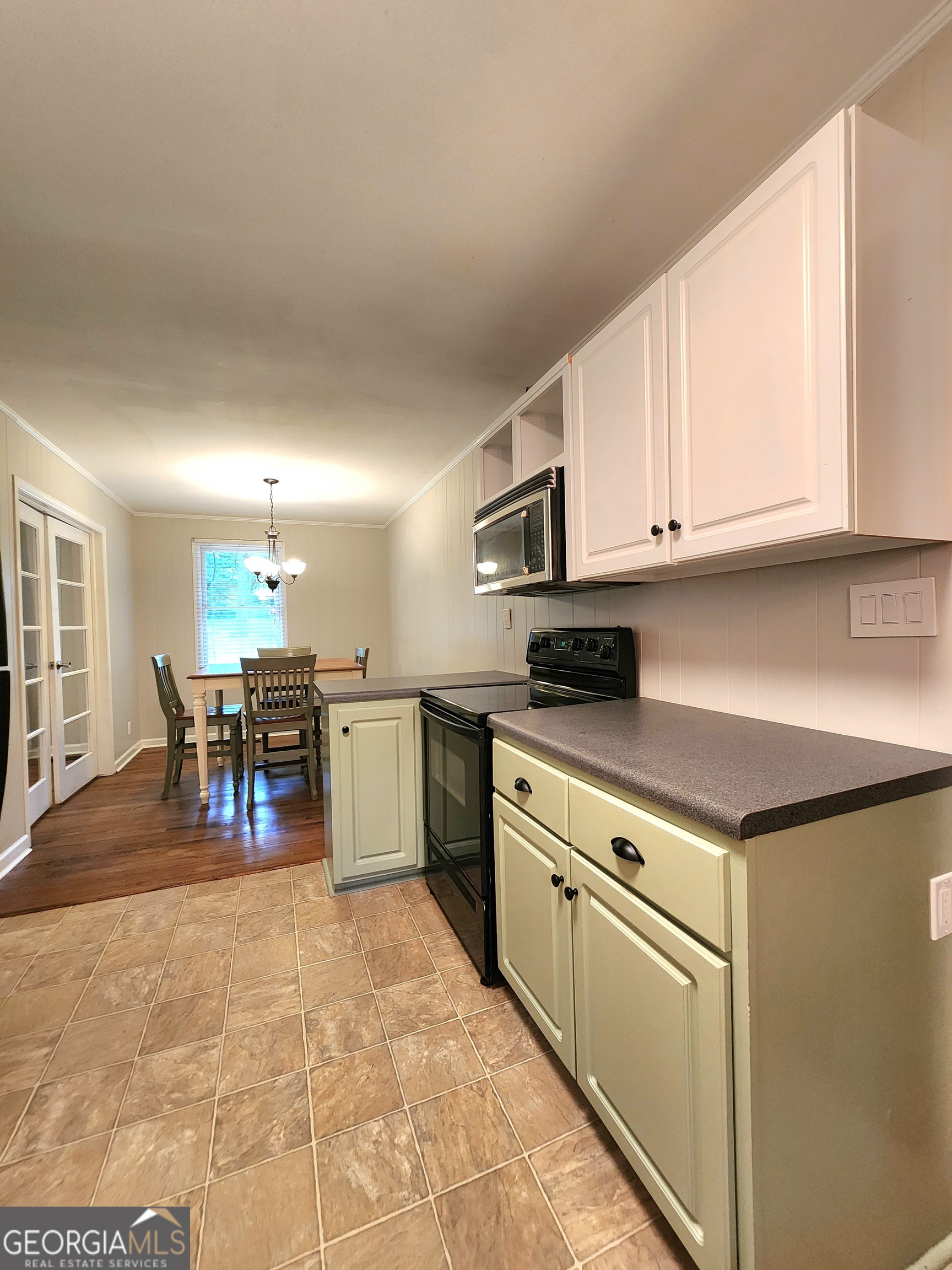 807 Wera Place Macon, GA 31210 - Photo 8 of 46 a kitchen with stainless steel appliances granite countertop a stove and a sink