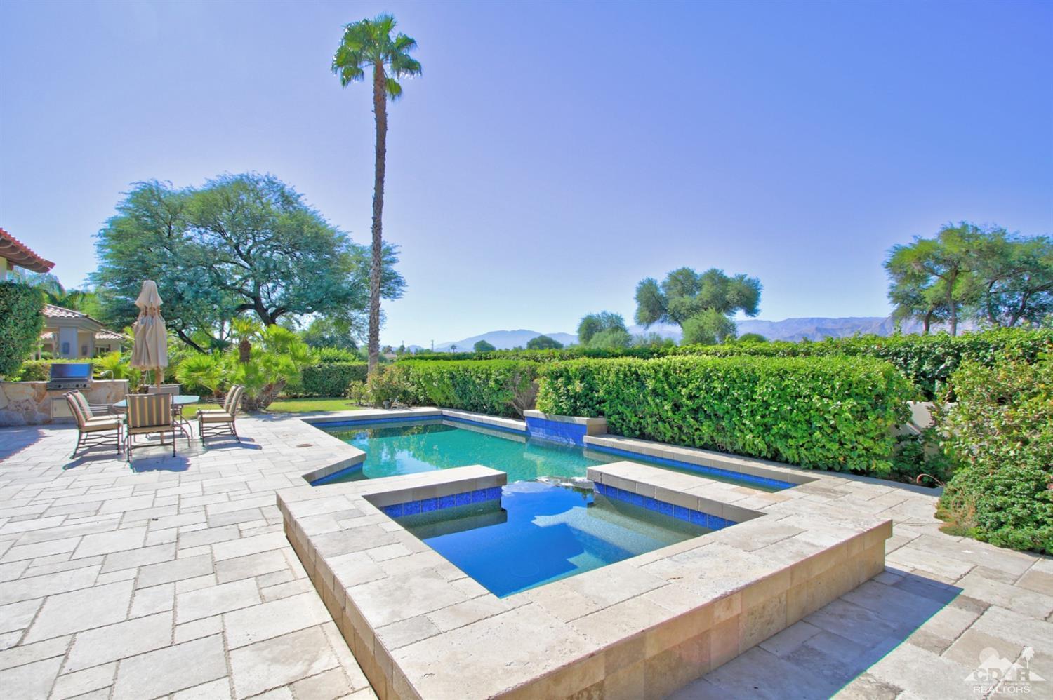 204 Loch Lomond Road Rancho Mirage, CA 92270 - Photo 2 of 45 a view of a patio with a table and chairs potted plants