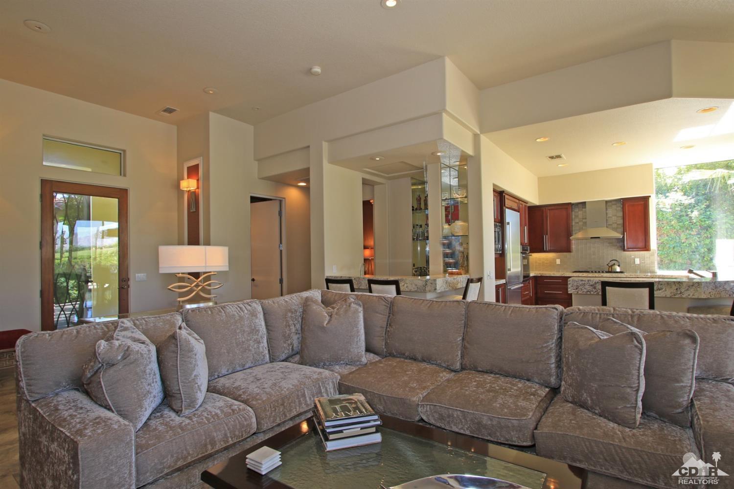 204 Loch Lomond Road Rancho Mirage, CA 92270 - Photo 11 of 45 a living room with furniture and a large window