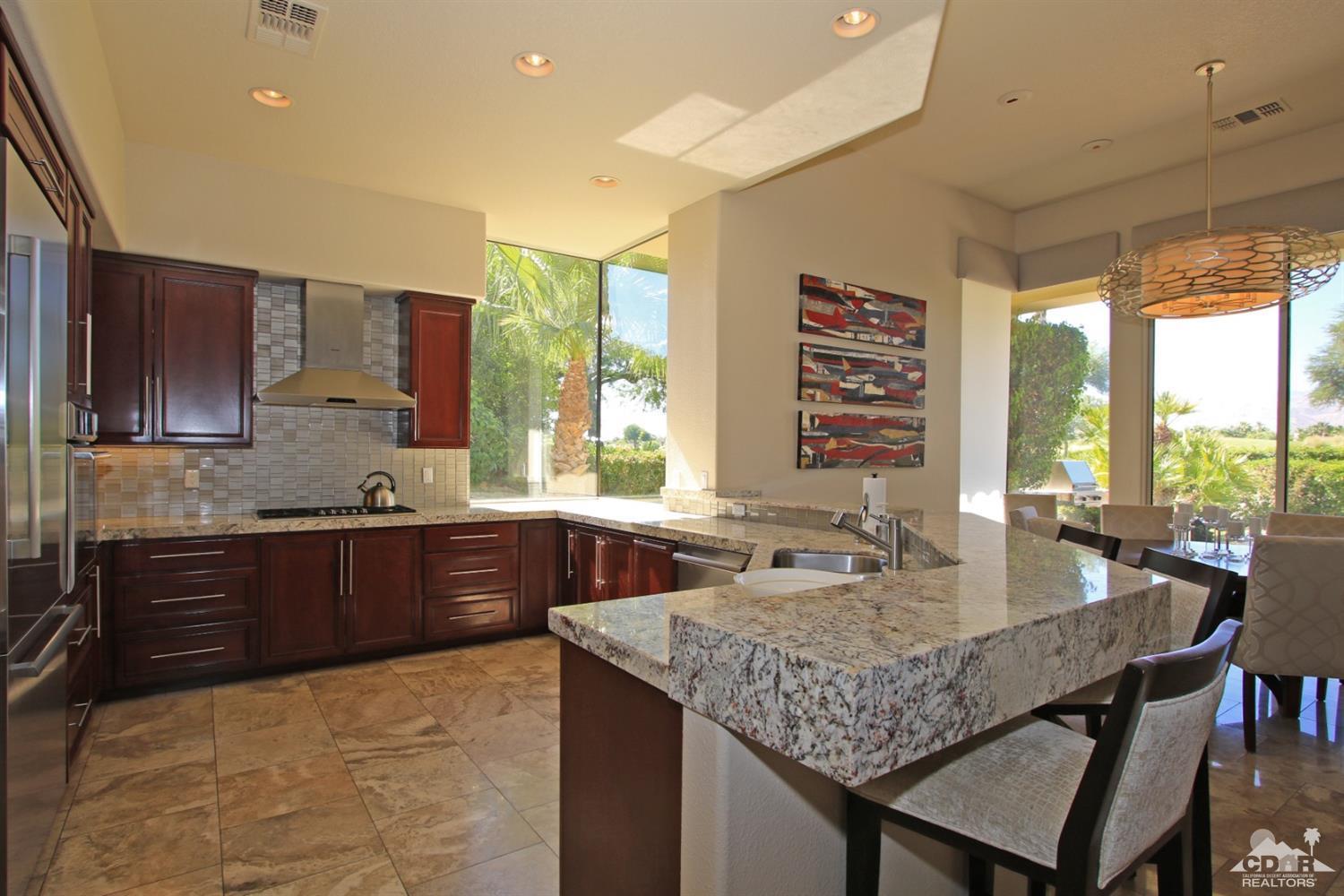 204 Loch Lomond Road Rancho Mirage, CA 92270 - Photo 14 of 45 a kitchen with stainless steel appliances granite countertop sink stove and refrigerator