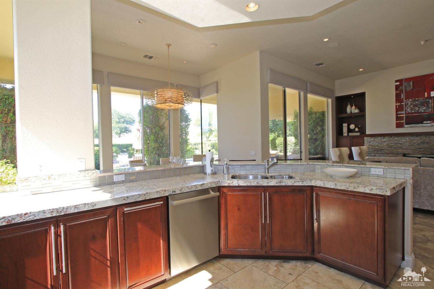 204 Loch Lomond Road Rancho Mirage, CA 92270 - Photo 15 of 45 a kitchen with lots of counter space and windows