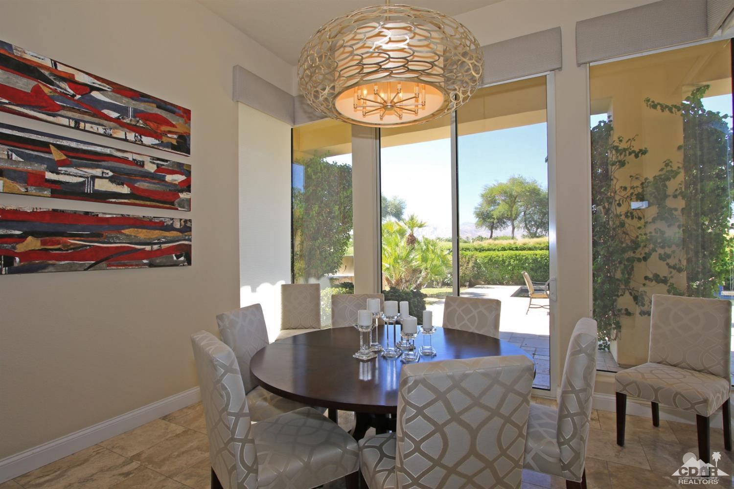 204 Loch Lomond Road Rancho Mirage, CA 92270 - Photo 17 of 45 a view of a dining room with furniture wooden floor and chandelier