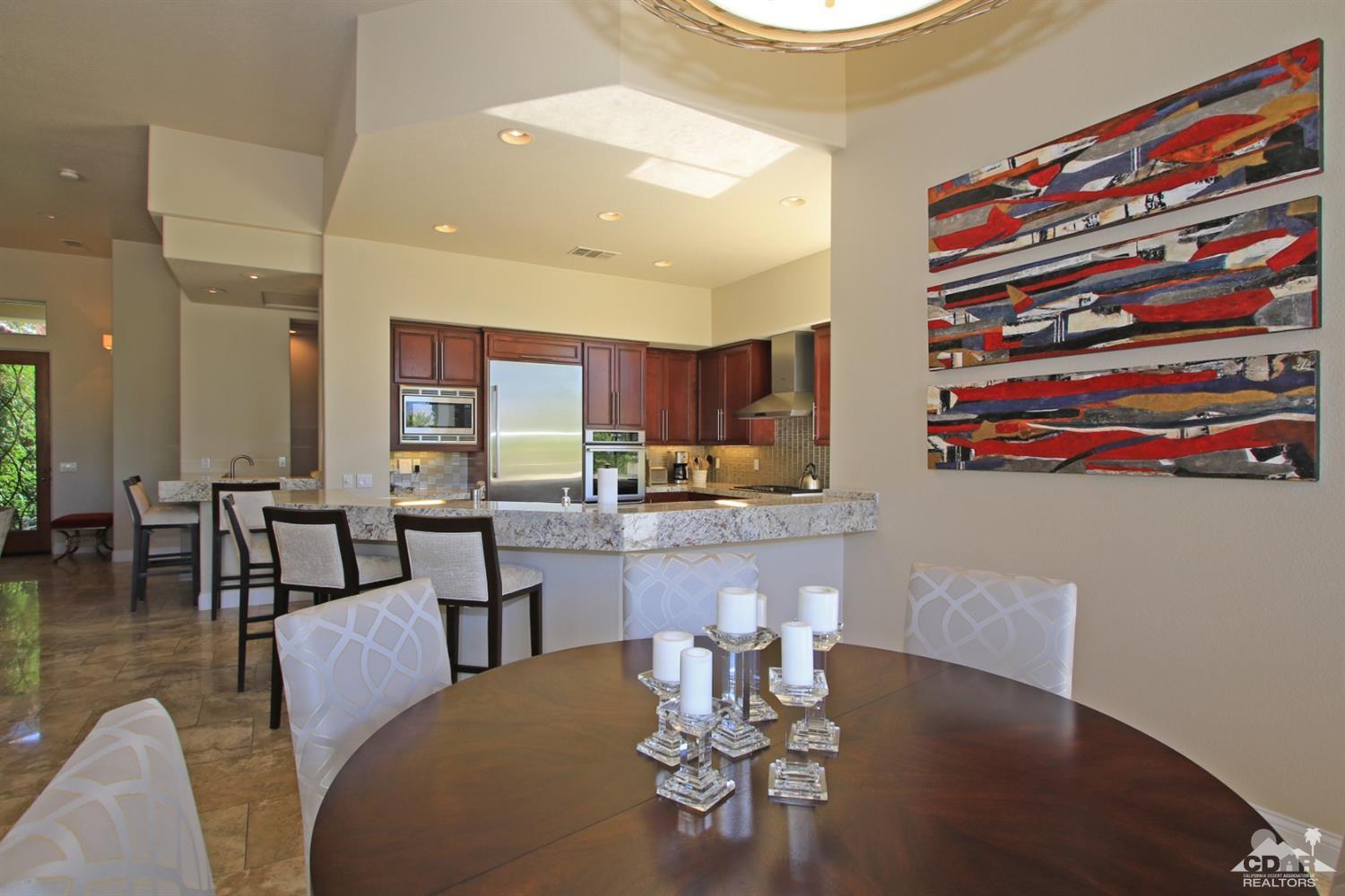 204 Loch Lomond Road Rancho Mirage, CA 92270 - Photo 18 of 45 a living room with stainless steel appliances kitchen island granite countertop furniture and a dining table
