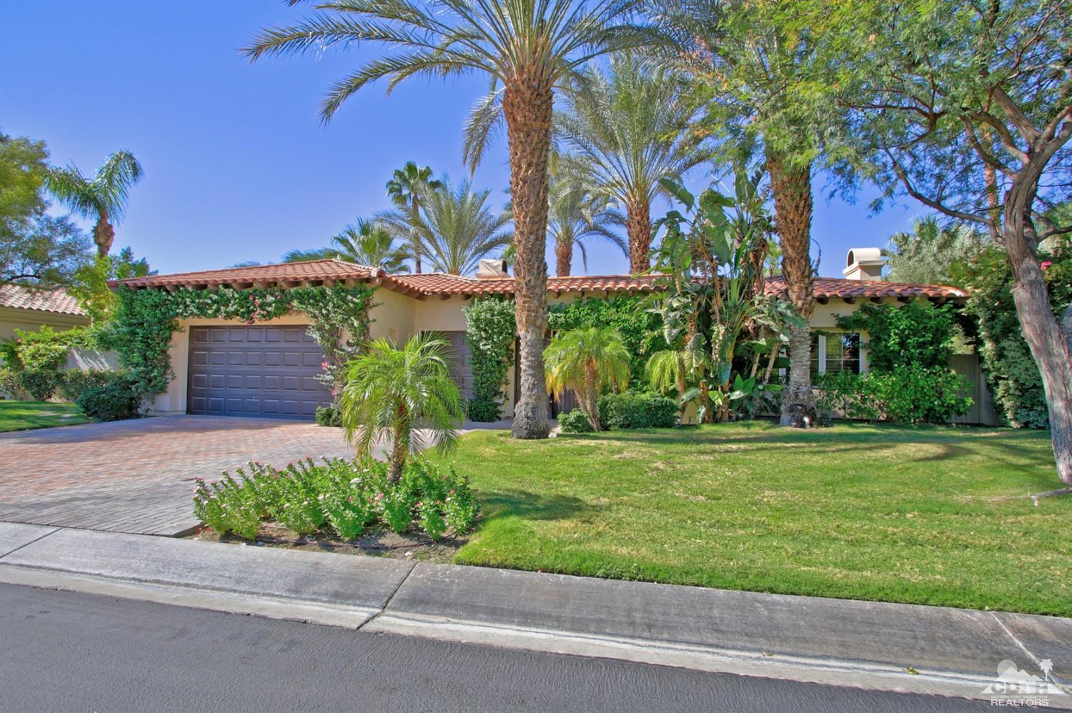 204 Loch Lomond Road Rancho Mirage, CA 92270 - Photo 3 of 45 a front view of a house with a yard and potted plants