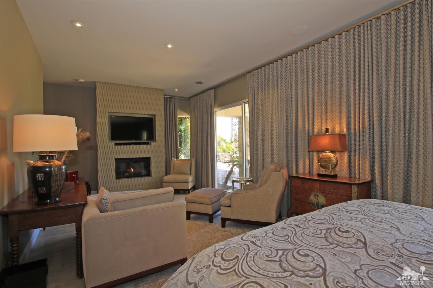 204 Loch Lomond Road Rancho Mirage, CA 92270 - Photo 21 of 45 a bedroom with a bed and a couch