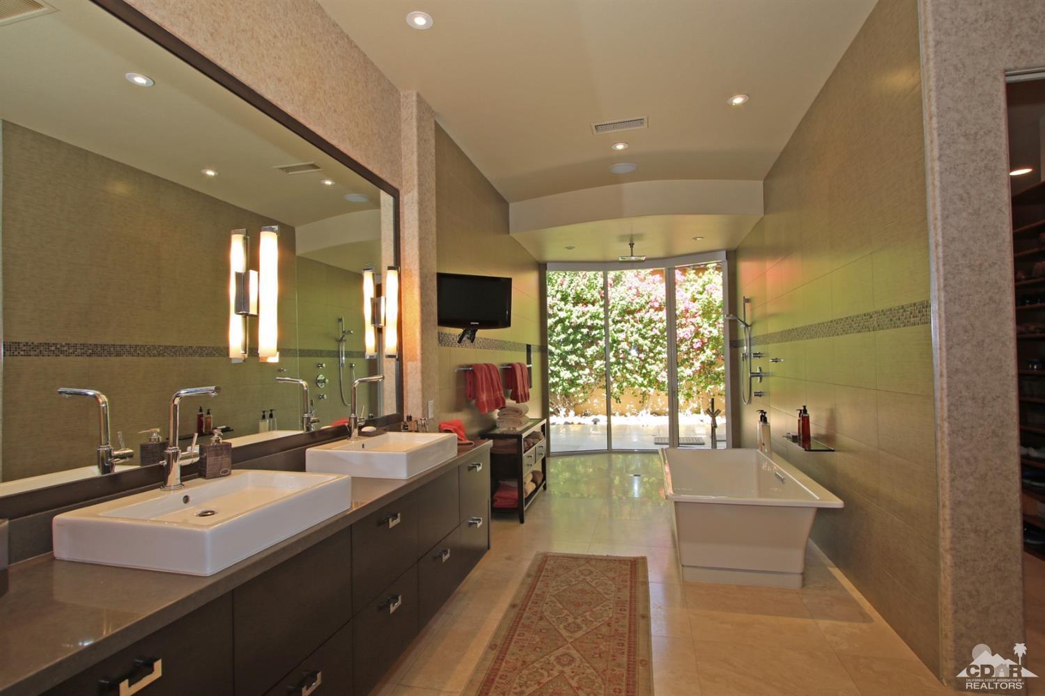 204 Loch Lomond Road Rancho Mirage, CA 92270 - Photo 23 of 45 a large bathroom with a large tub and sink