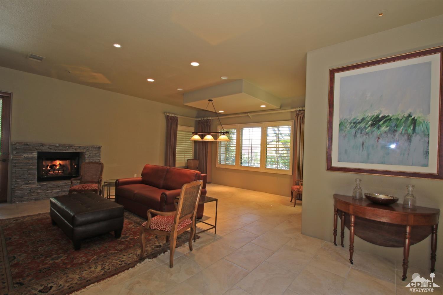 204 Loch Lomond Road Rancho Mirage, CA 92270 - Photo 27 of 45 a living room with furniture and a large window