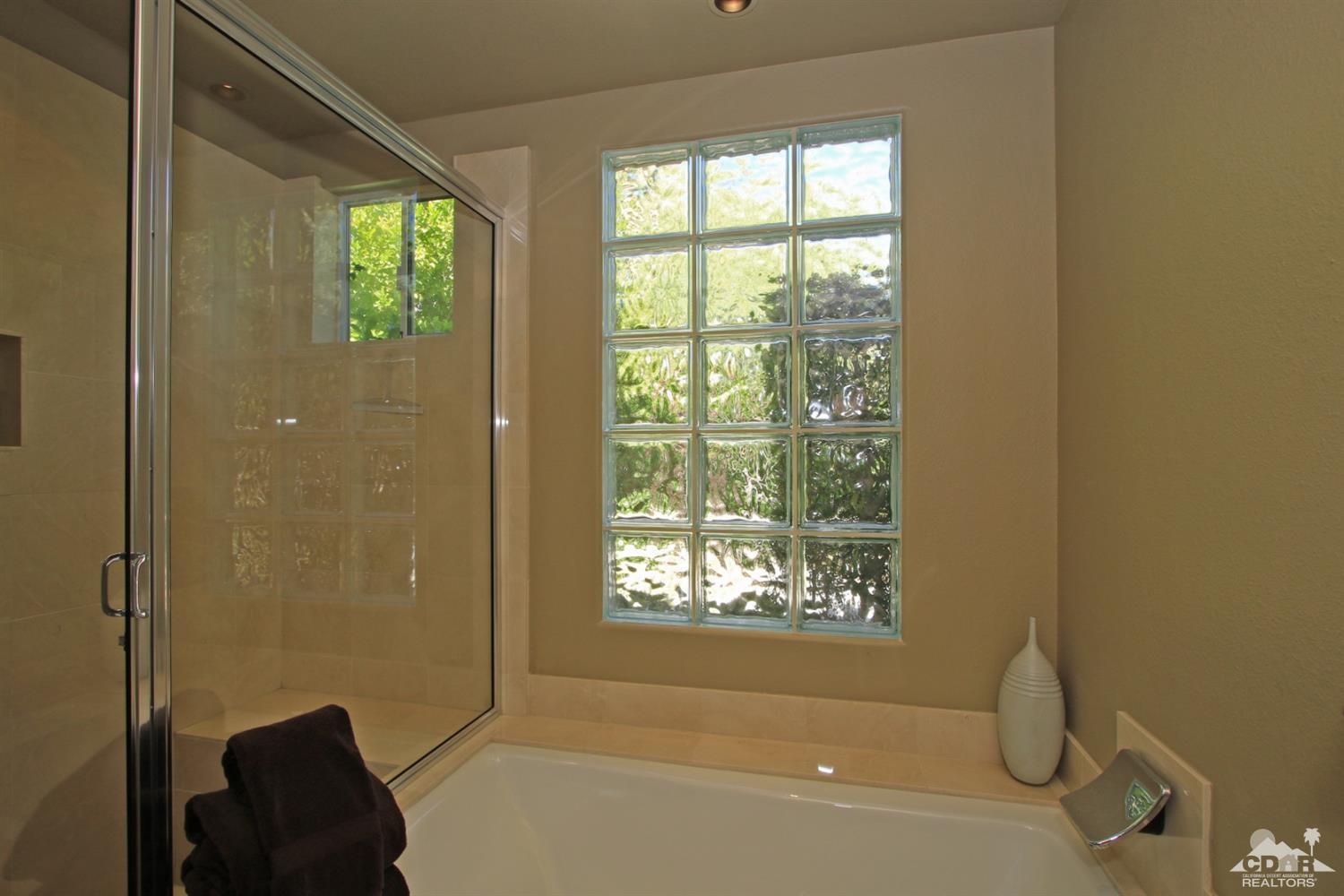 204 Loch Lomond Road Rancho Mirage, CA 92270 - Photo 32 of 45 a bathroom with a bathtub and shower
