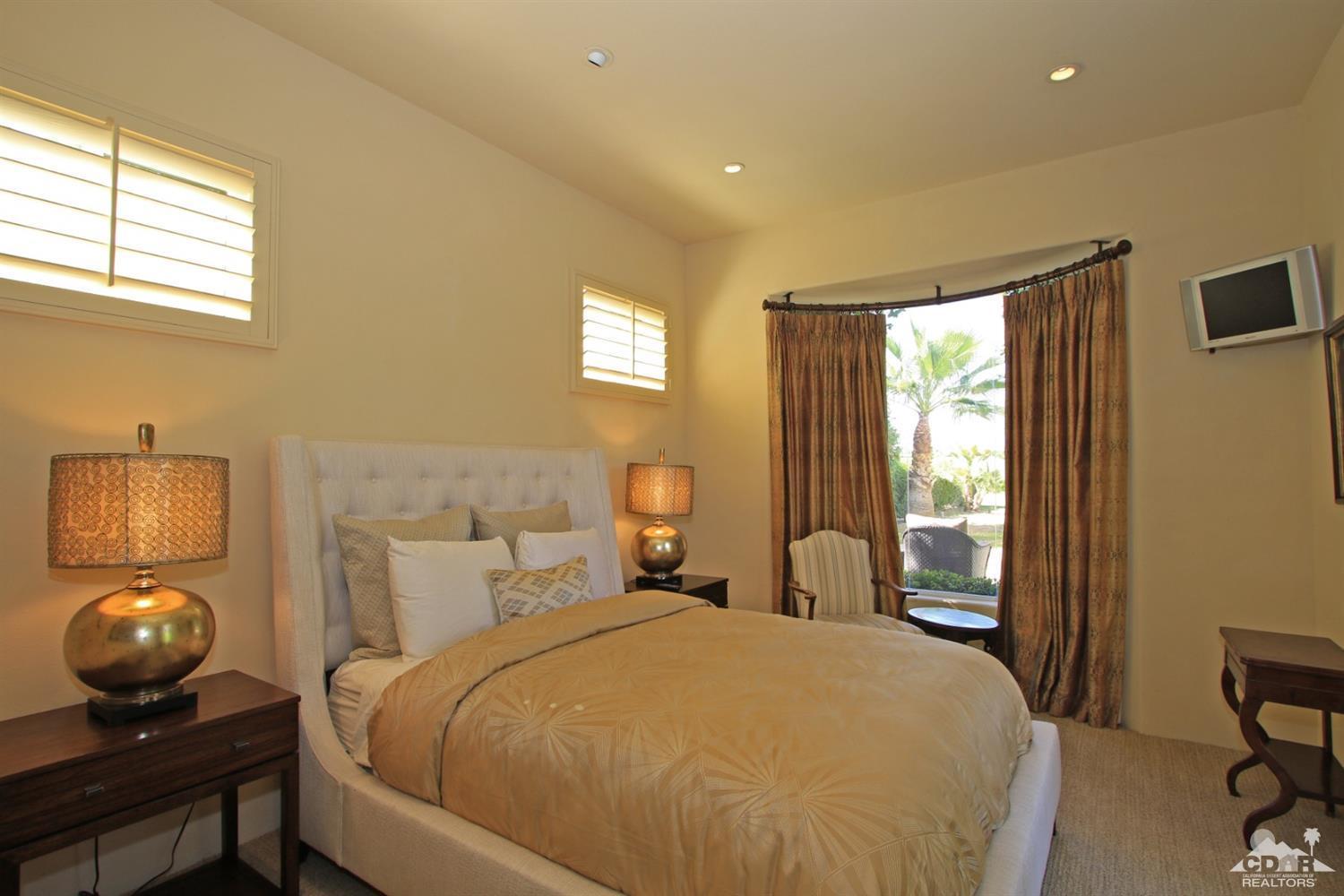 204 Loch Lomond Road Rancho Mirage, CA 92270 - Photo 34 of 45 a bedroom with a bed and window