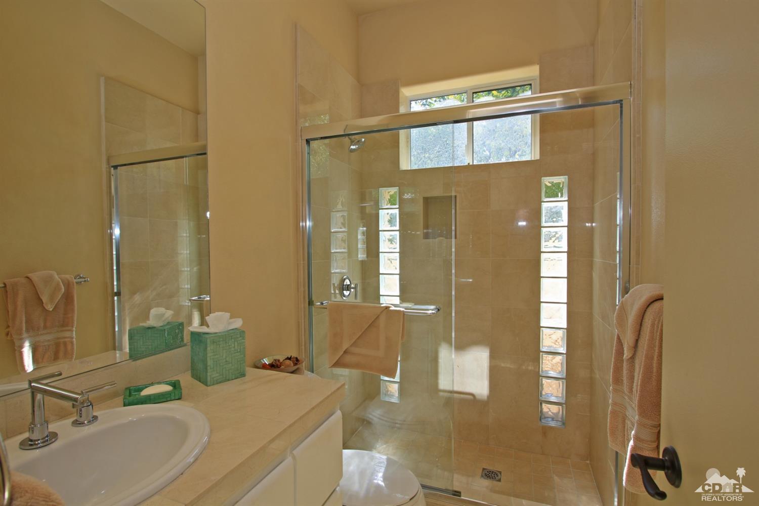 204 Loch Lomond Road Rancho Mirage, CA 92270 - Photo 35 of 45 a bathroom with a sink and a mirror
