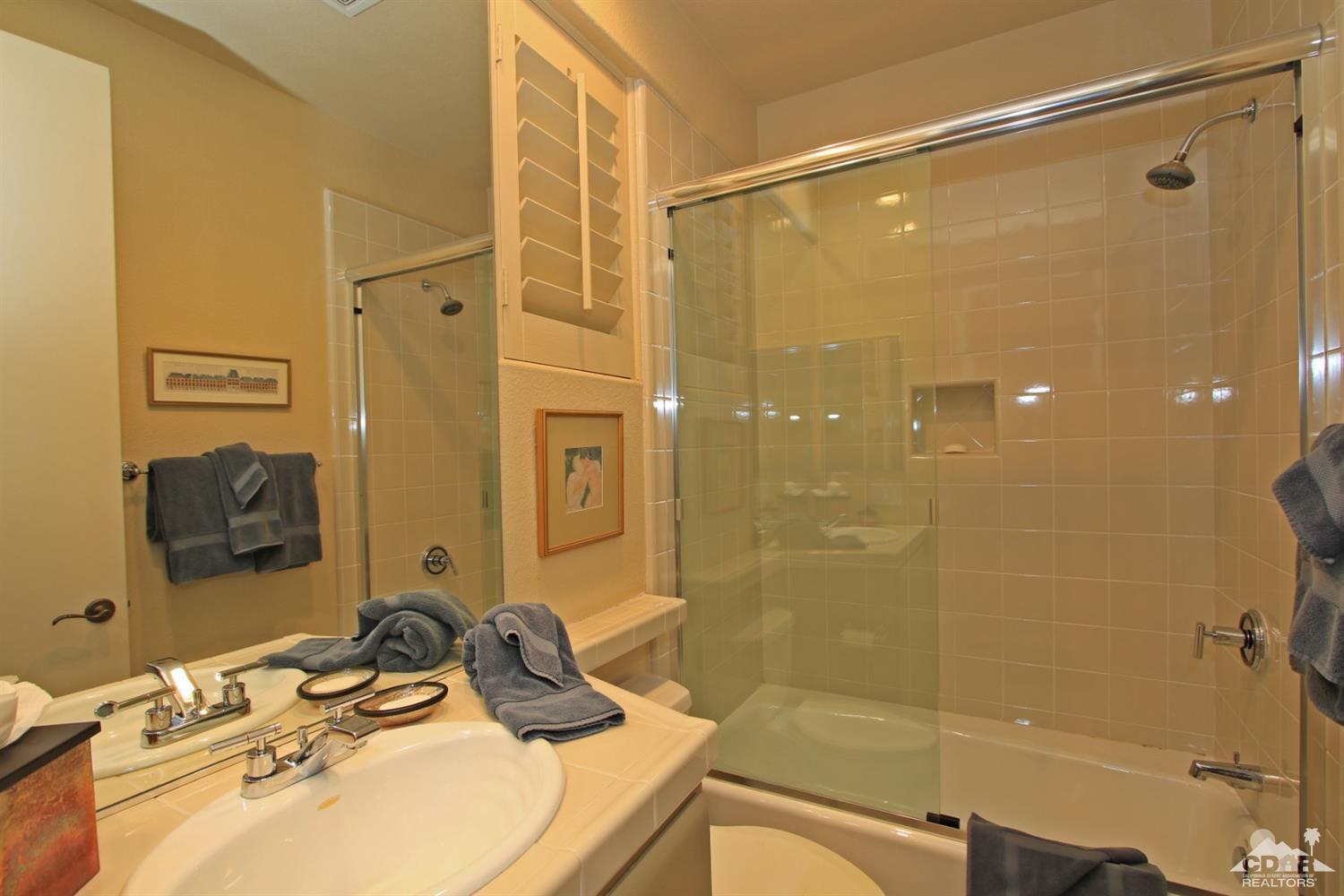 204 Loch Lomond Road Rancho Mirage, CA 92270 - Photo 38 of 45 a bathroom with a sink shower and a mirror