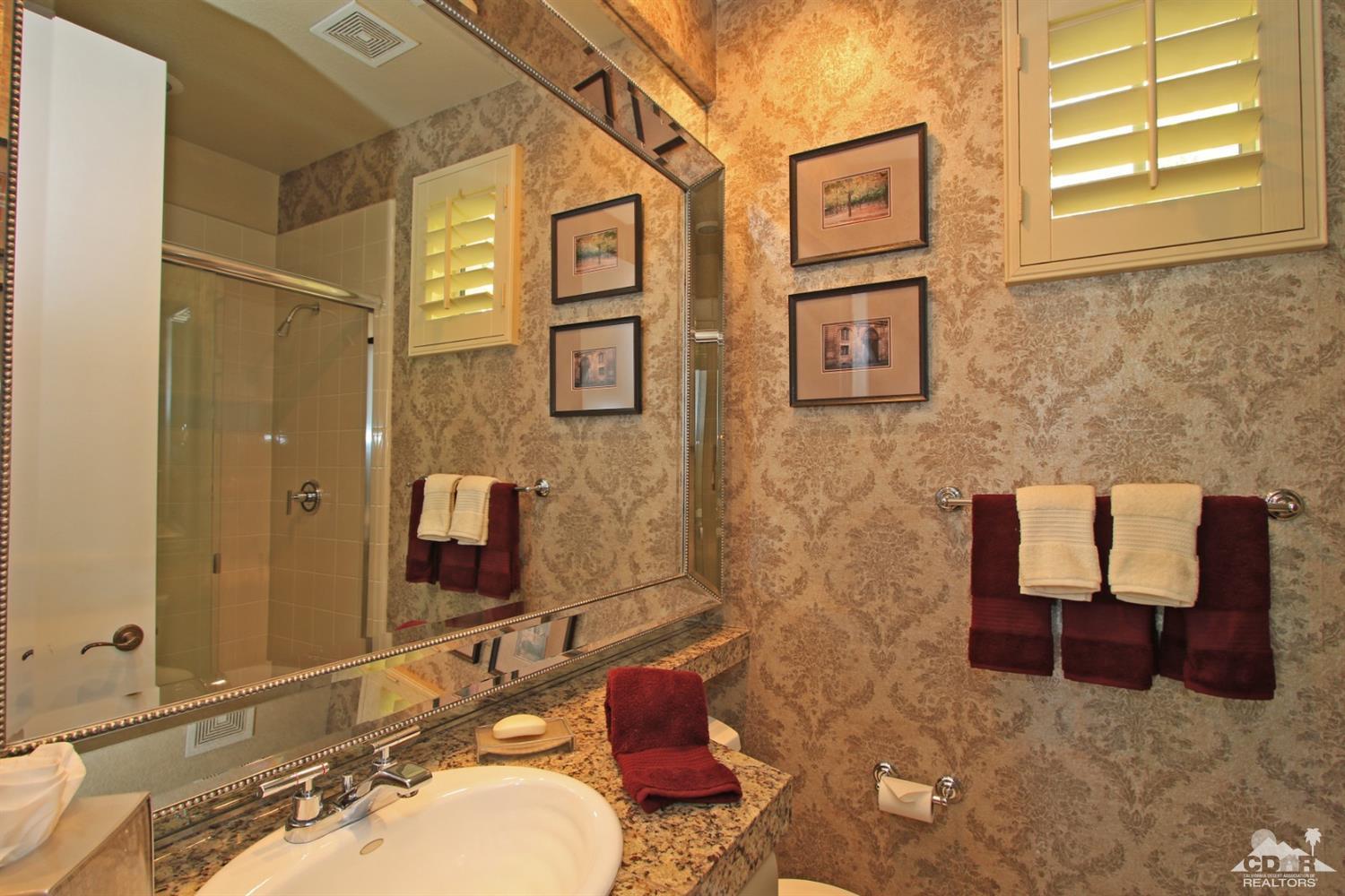 204 Loch Lomond Road Rancho Mirage, CA 92270 - Photo 39 of 45 a bathroom with a sink and a mirror