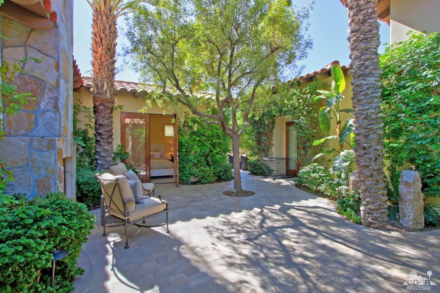 204 Loch Lomond Road Rancho Mirage, CA 92270 - Photo 5 of 45 a view of a patio with table and chairs and potted plants