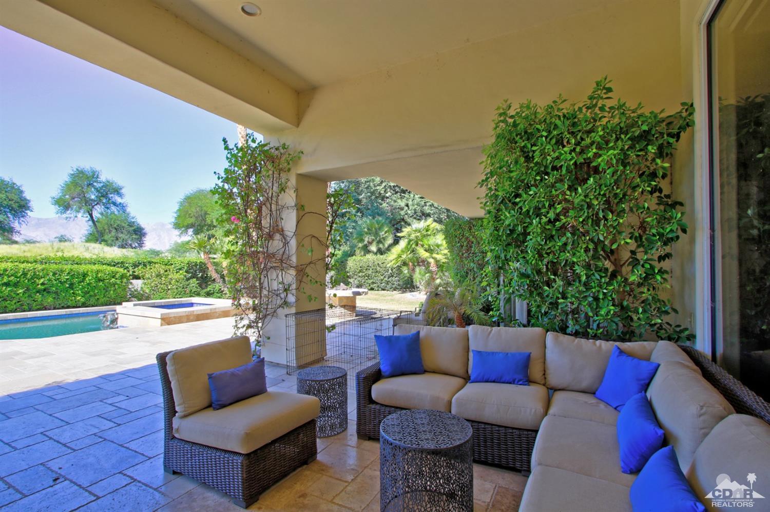 204 Loch Lomond Road Rancho Mirage, CA 92270 - Photo 42 of 45 a outdoor living space with furniture and garden view