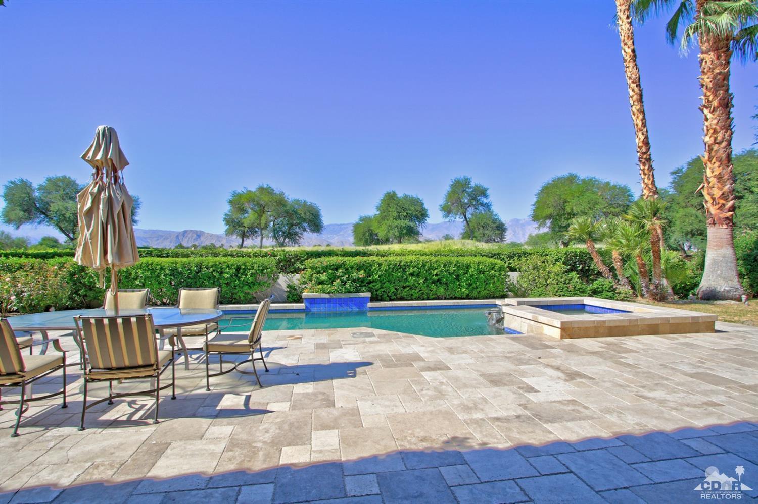 204 Loch Lomond Road Rancho Mirage, CA 92270 - Photo 45 of 45 a view of a patio with a table and chairs