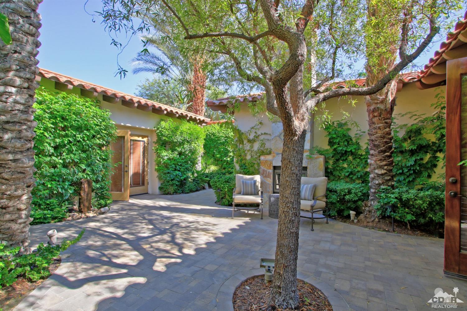 204 Loch Lomond Road Rancho Mirage, CA 92270 - Photo 6 of 45 a view of a street with plants and trees