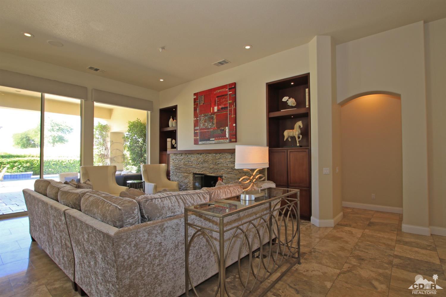 204 Loch Lomond Road Rancho Mirage, CA 92270 - Photo 8 of 45 a living room with furniture and a fireplace