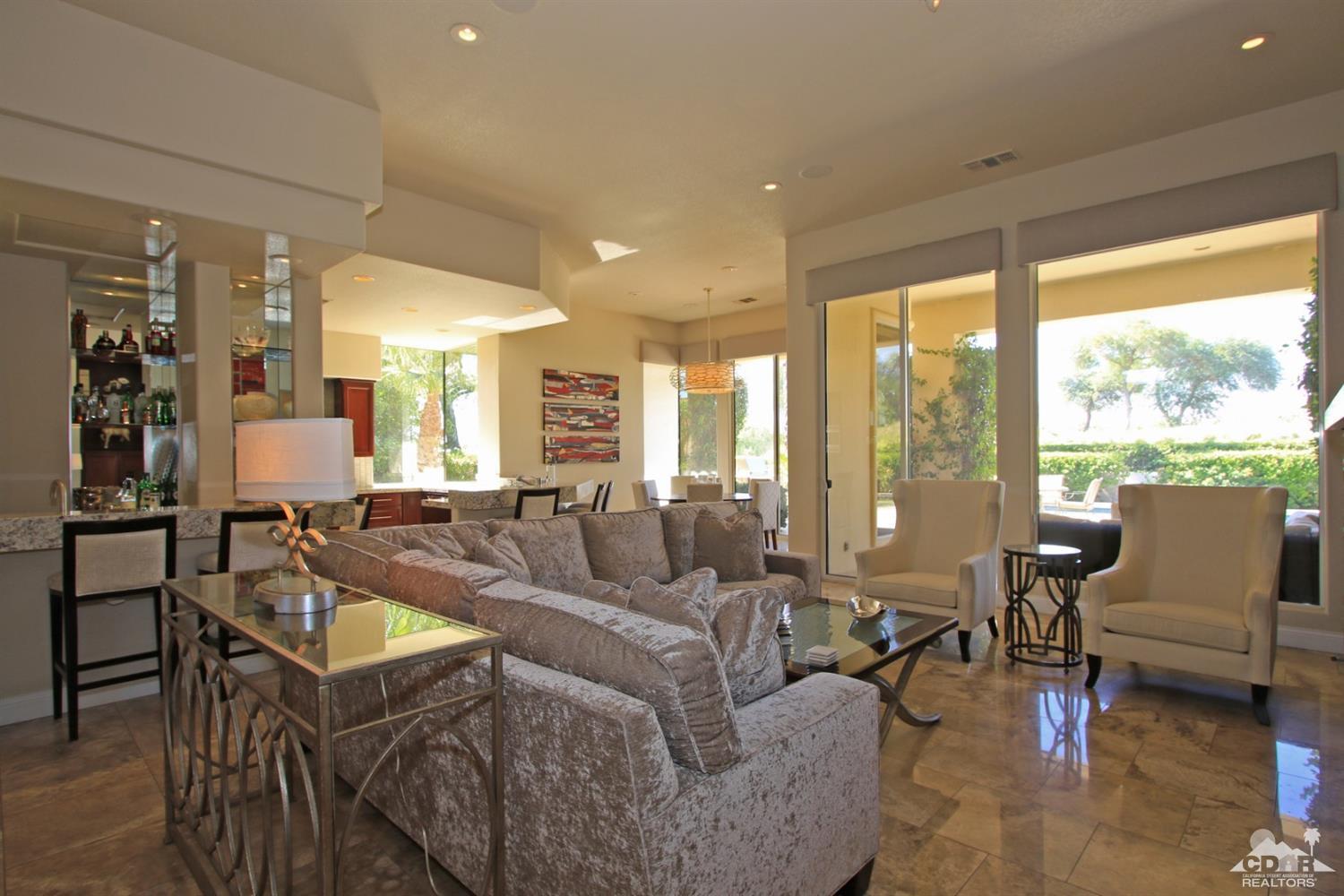 204 Loch Lomond Road Rancho Mirage, CA 92270 - Photo 9 of 45 a living room with furniture and a large window