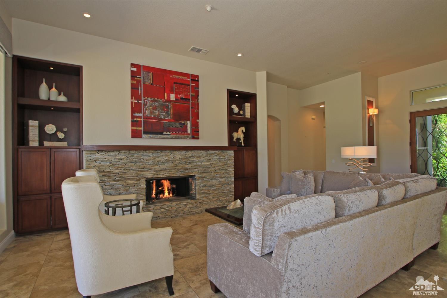 204 Loch Lomond Road Rancho Mirage, CA 92270 - Photo 10 of 45 a living room with furniture and a fireplace