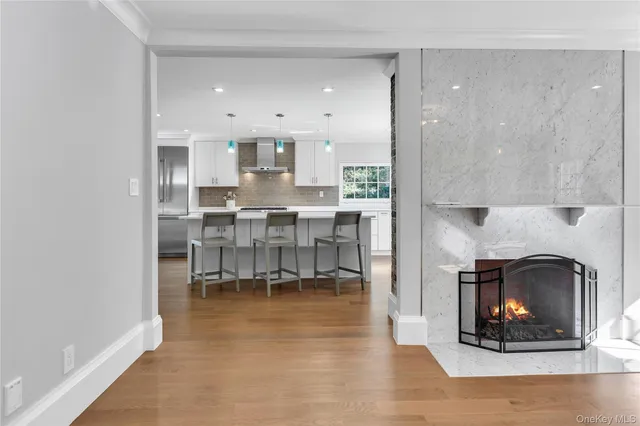 a view of a kitchen with white cabinets