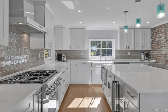 a bathroom with a toilet sink vanity and mirror