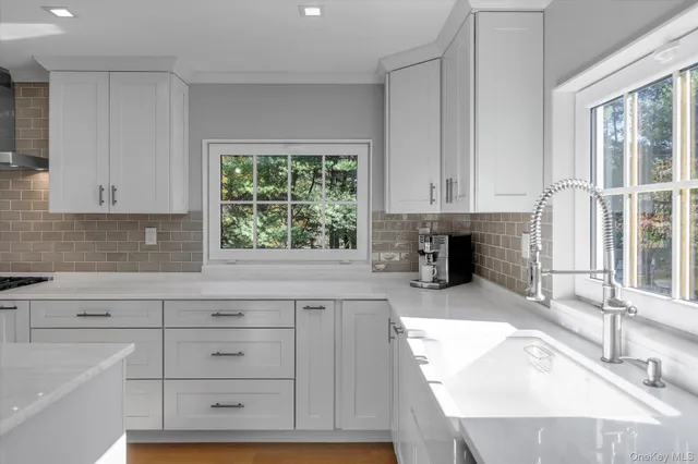 a view of a kitchen with a sink cabinets and a window