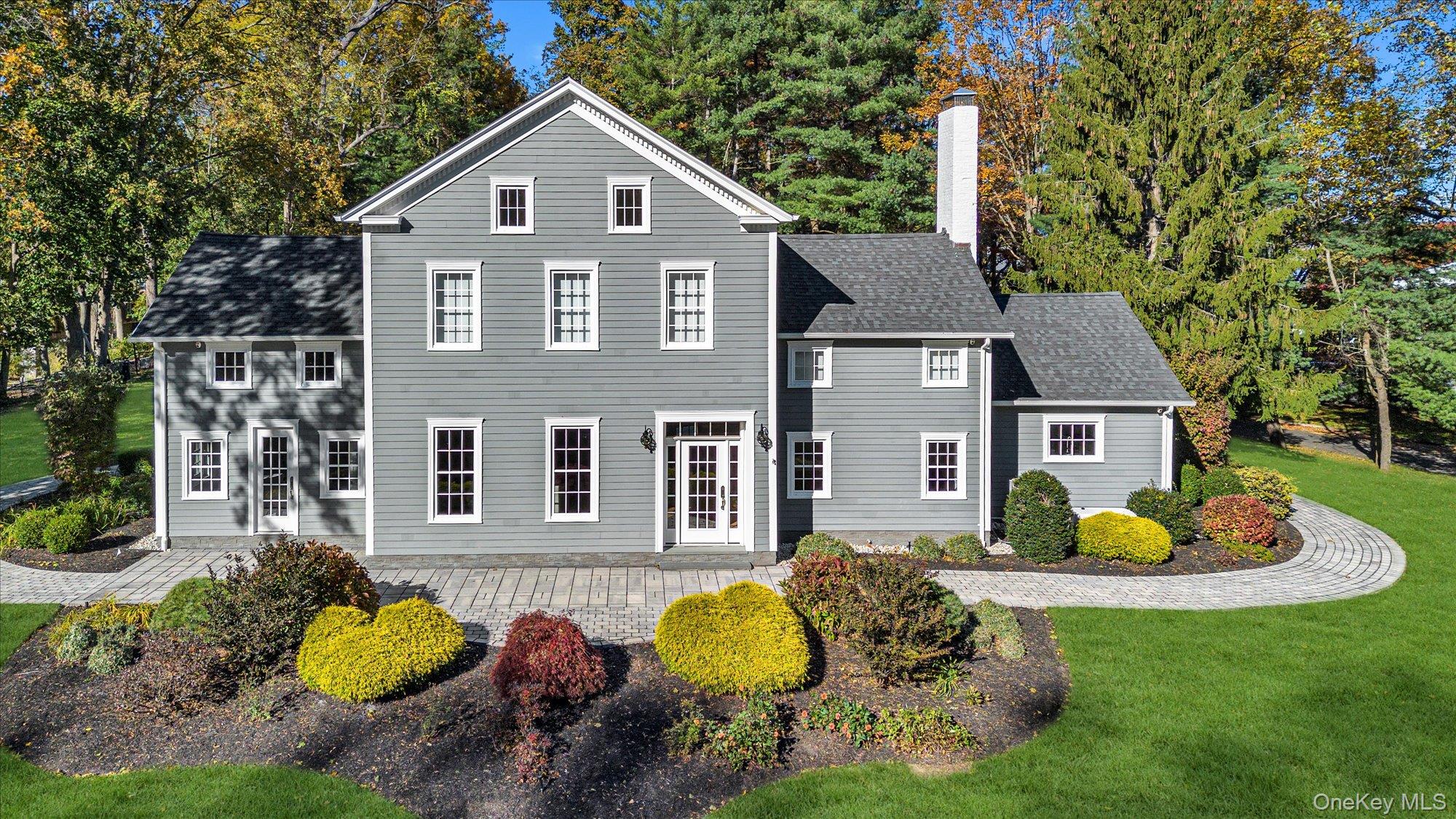 22 Fort Salonga Road Centerport, NY 11721 - Photo 2 of 42 a front view of house with yard and trees