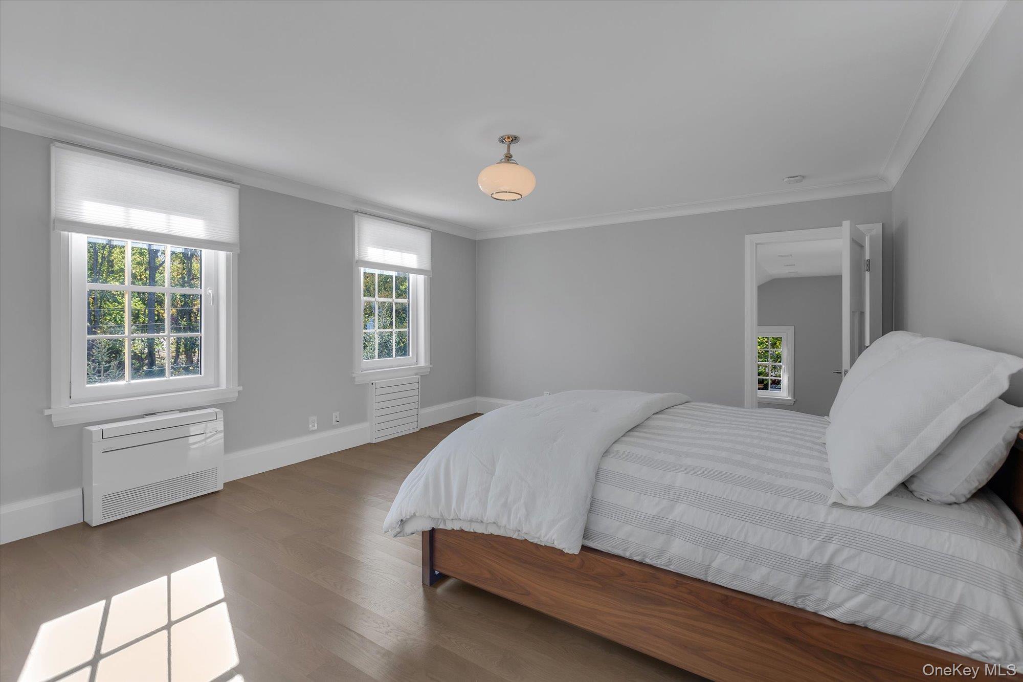 22 Fort Salonga Road Centerport, NY 11721 - Photo 22 of 42 a bedroom with a bed and window