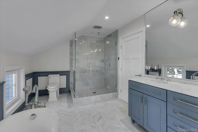 a view of a backyard with table and chairs under an umbrella