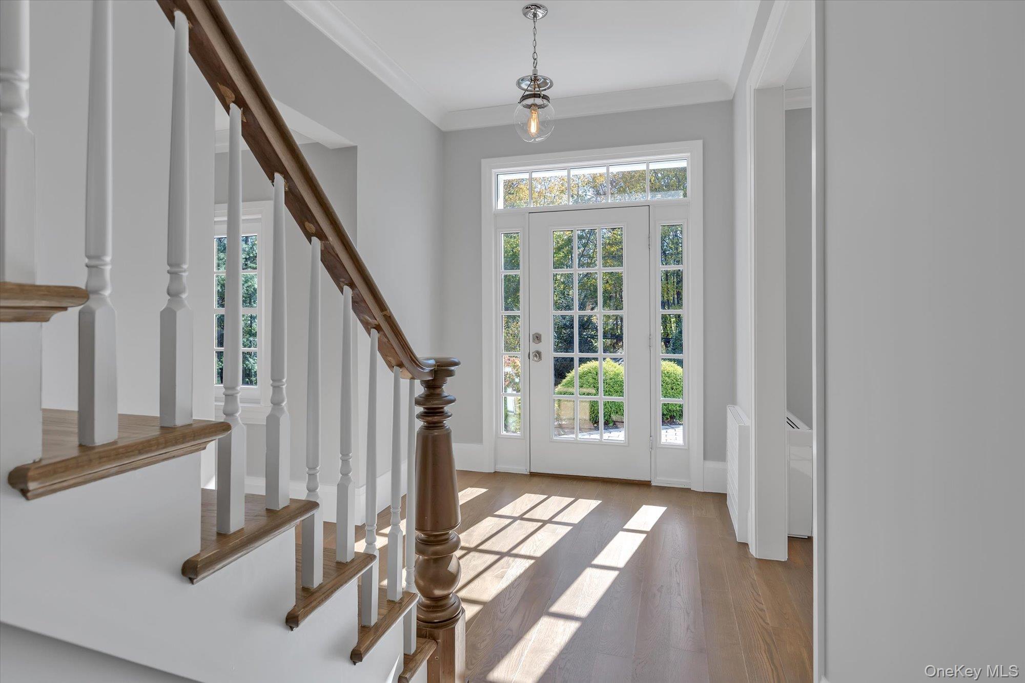 22 Fort Salonga Road Centerport, NY 11721 - Photo 3 of 42 a view of an entryway with wooden floor