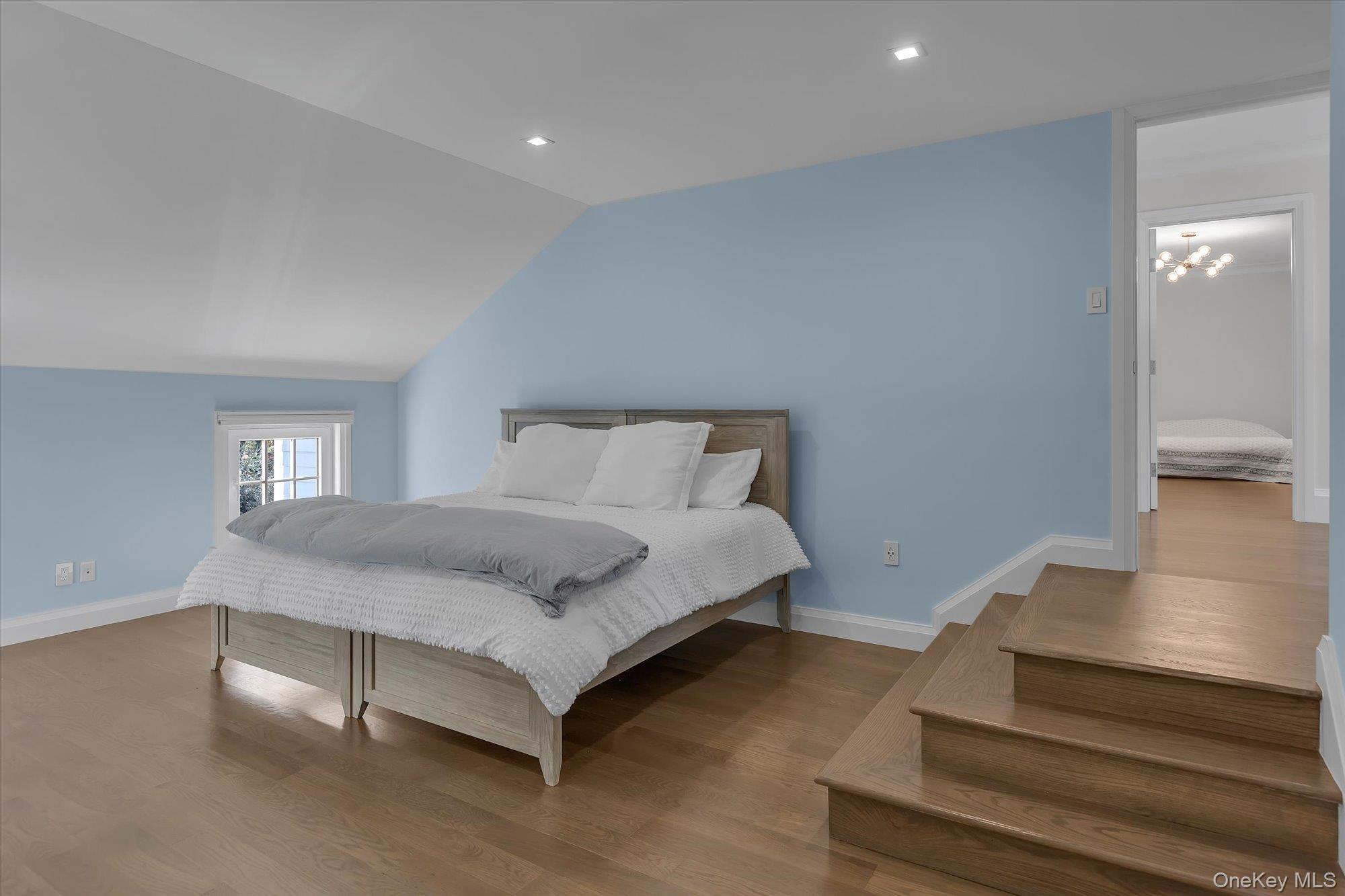 22 Fort Salonga Road Centerport, NY 11721 - Photo 31 of 42 a bedroom with a bed and a night stand