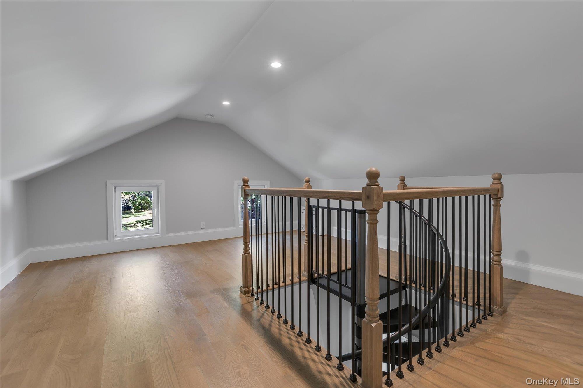 22 Fort Salonga Road Centerport, NY 11721 - Photo 36 of 42 a view of a hallway with wooden floor and stairs