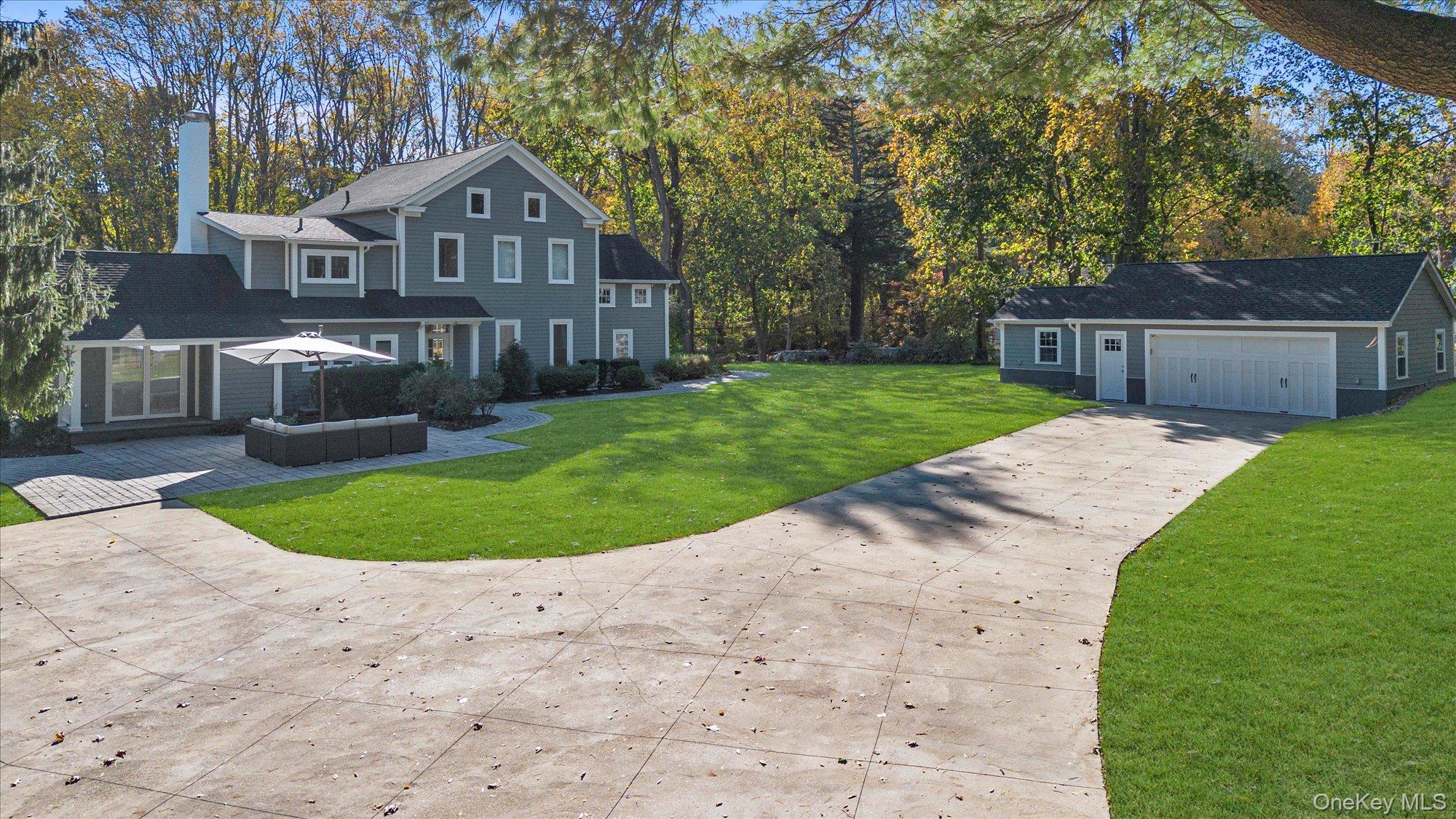 22 Fort Salonga Road Centerport, NY 11721 - Photo 40 of 42 a view of a house with a swimming pool and a yard
