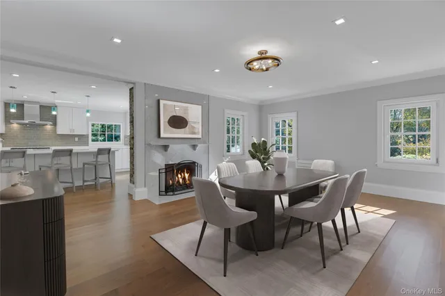 a kitchen with granite countertop a stove and a wooden floor