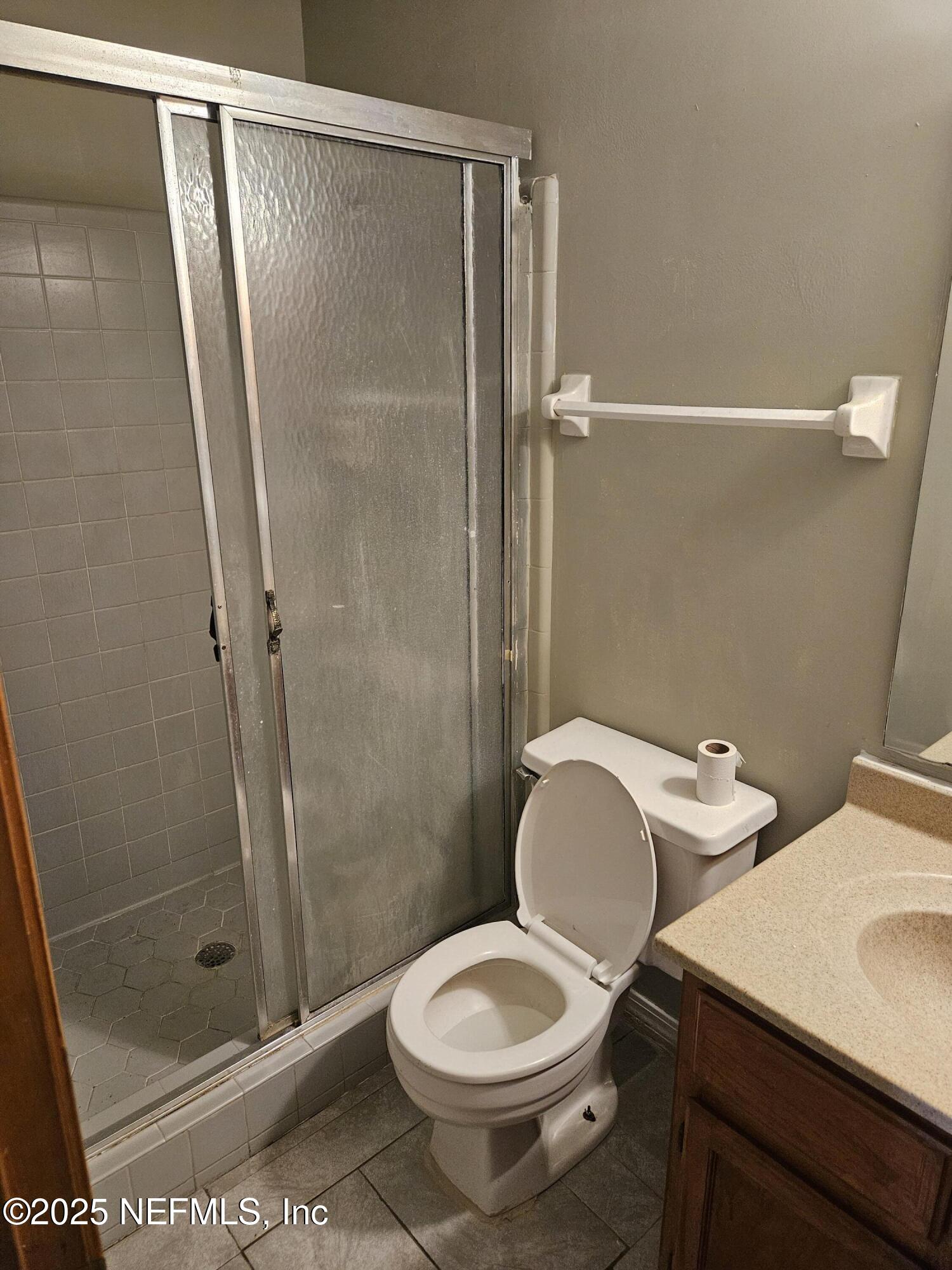 8256 Justin Road North Jacksonville, FL 32210 - Photo 13 of 35 a bathroom with a toilet and a shower