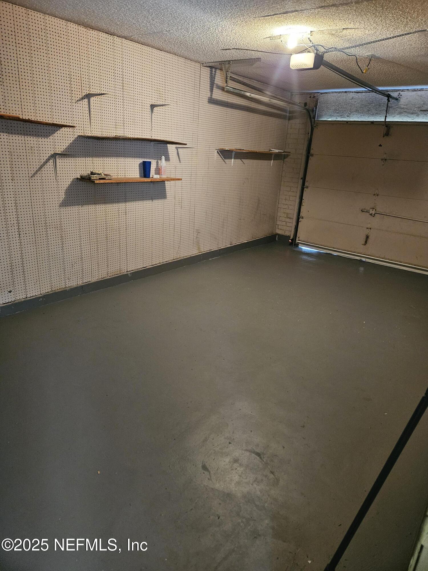 8256 Justin Road North Jacksonville, FL 32210 - Photo 20 of 35 a view of a refrigerator in kitchen and an empty room