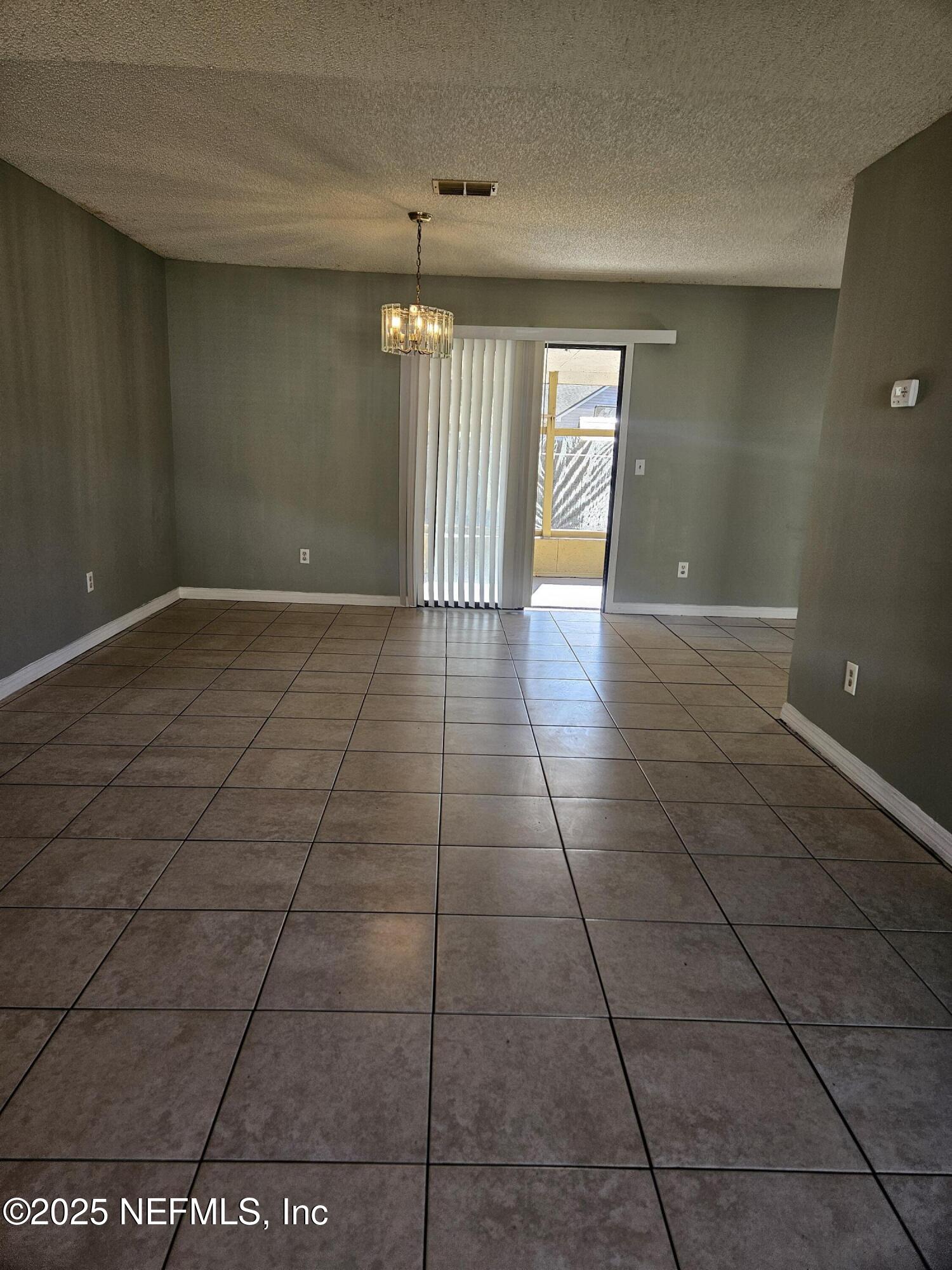 8256 Justin Road North Jacksonville, FL 32210 - Photo 25 of 35 a view of an empty room with a window