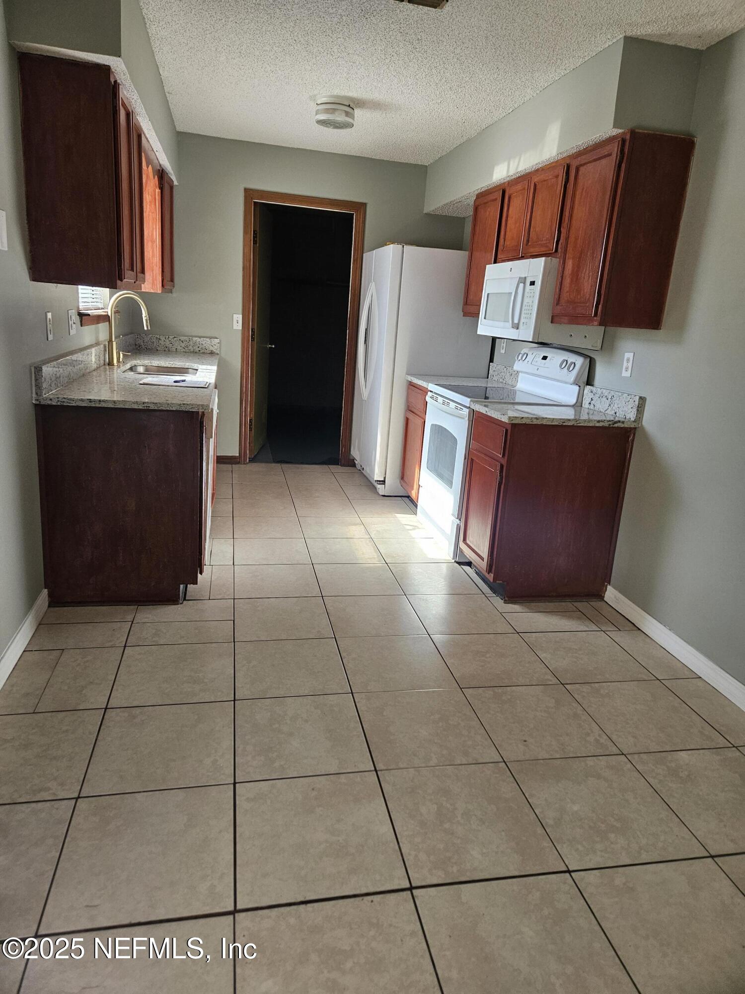 8256 Justin Road North Jacksonville, FL 32210 - Photo 27 of 35 a bathroom with a sink and a mirror