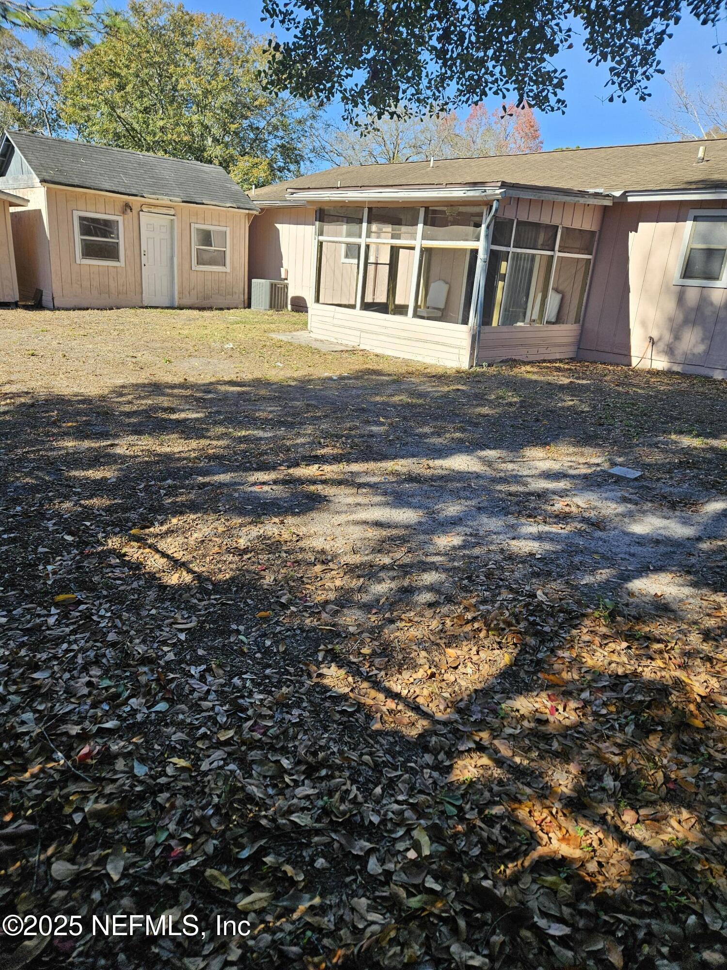 8256 Justin Road North Jacksonville, FL 32210 - Photo 30 of 35 a front view of a house with a yard