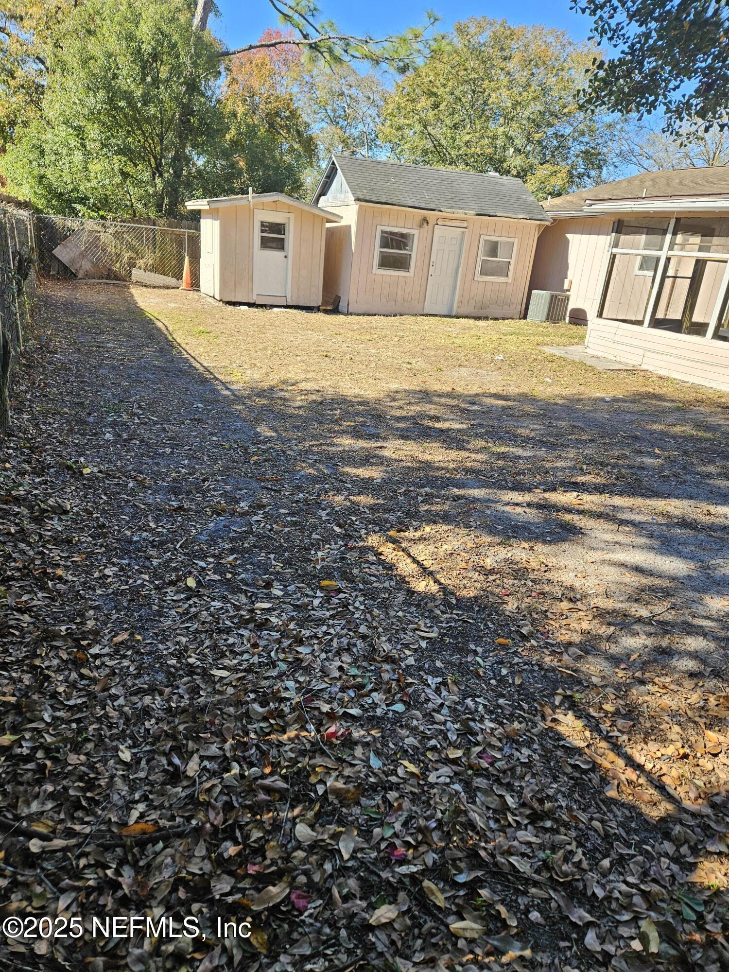 8256 Justin Road North Jacksonville, FL 32210 - Photo 31 of 35 a view of a house with a yard